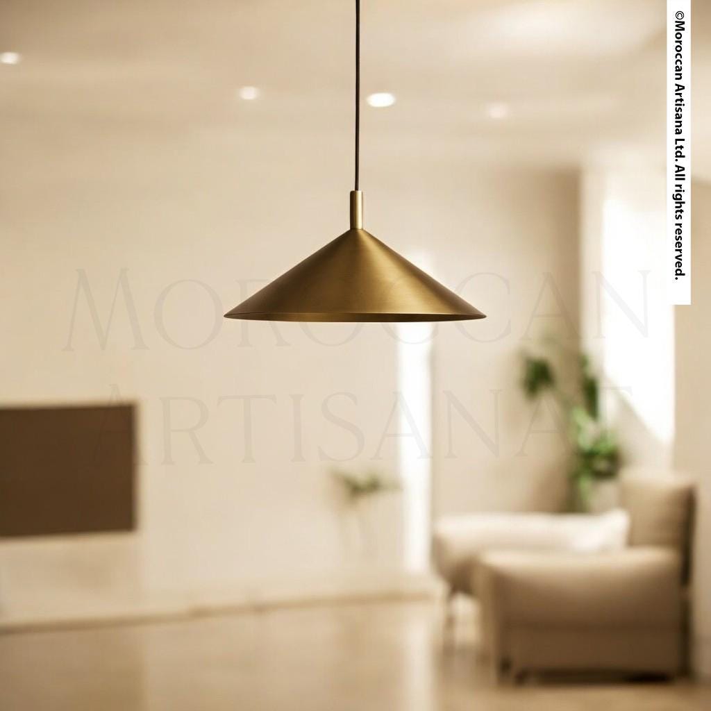 a modern, minimalist living room with a gold pendant lamp hanging from the ceiling.