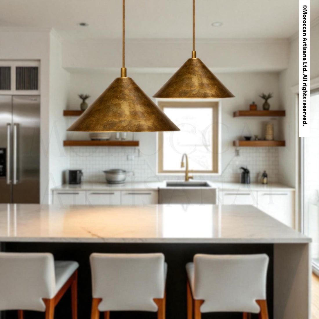 a modern kitchen with a large island, pendant lights, and white chairs.