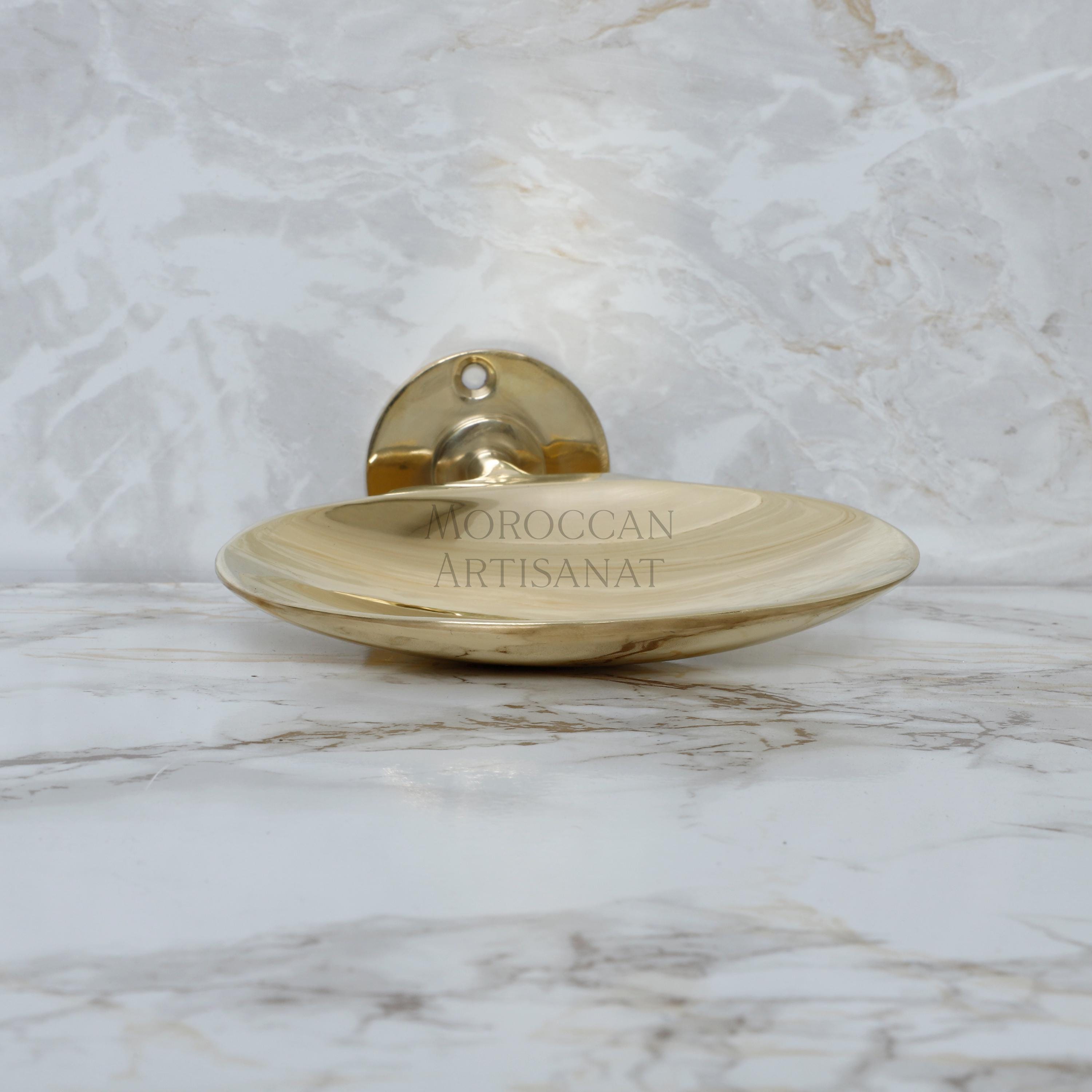 a gold plate on a marble counter top