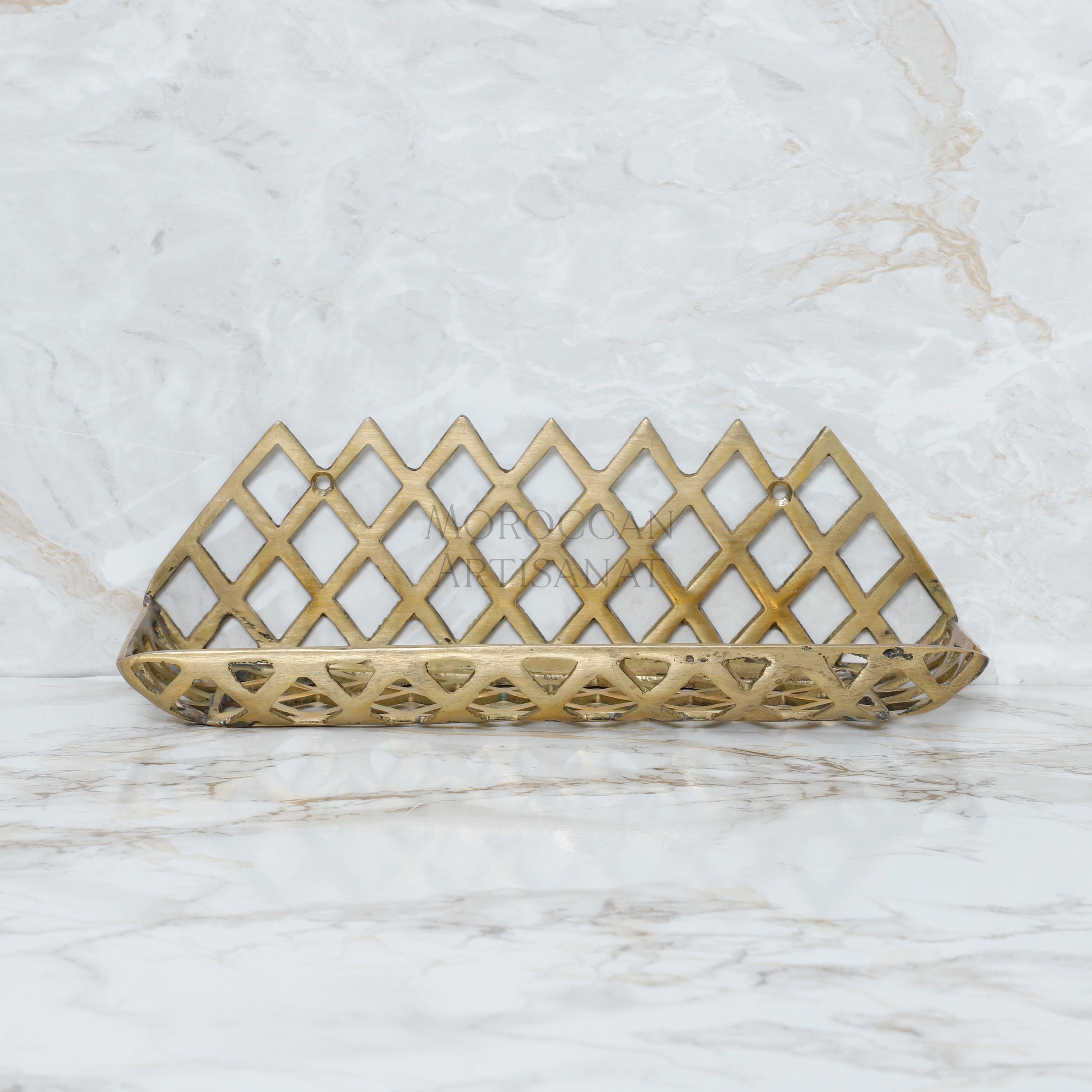 a golden metal object on a marble surface