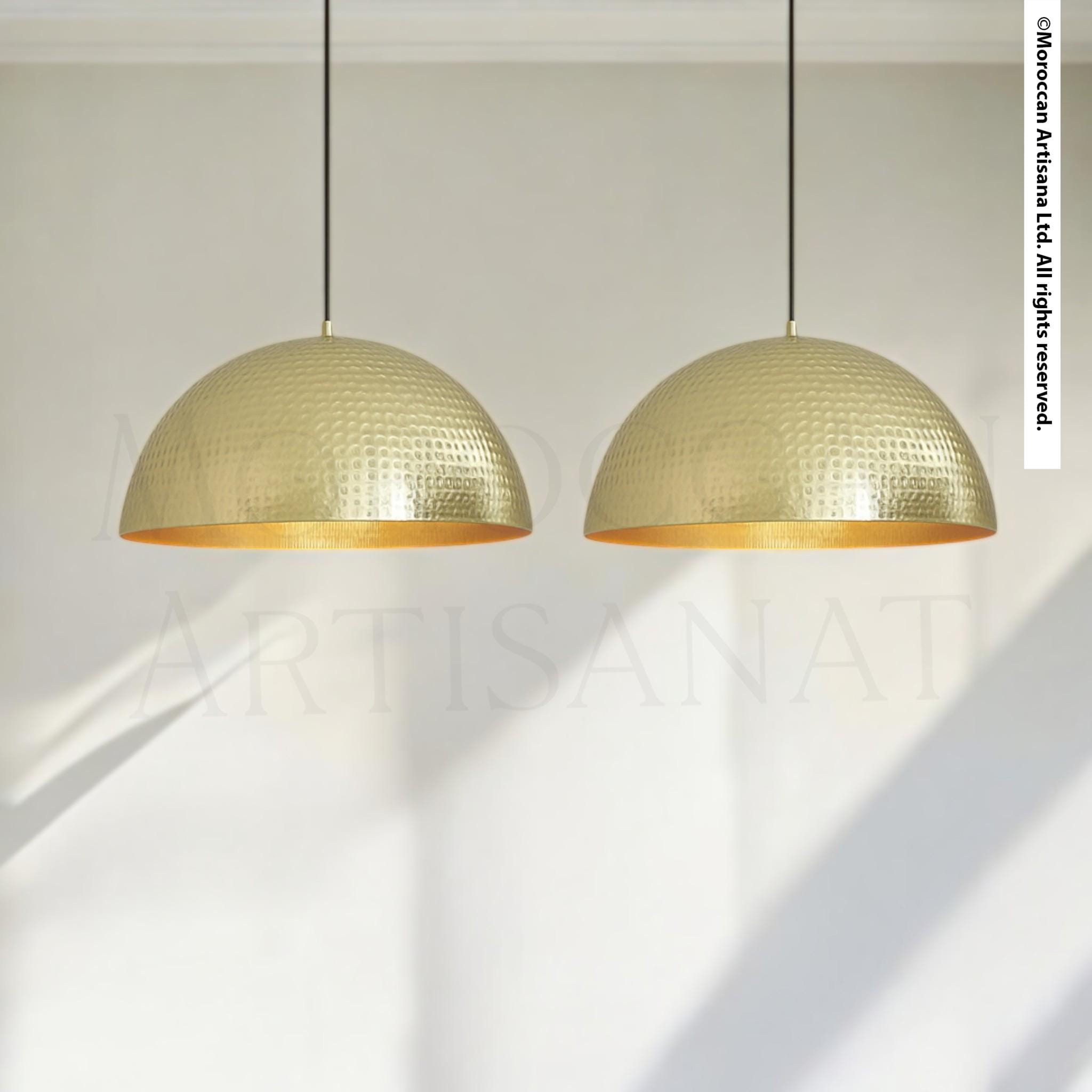 two gold-colored pendant lights hanging from the ceiling.
