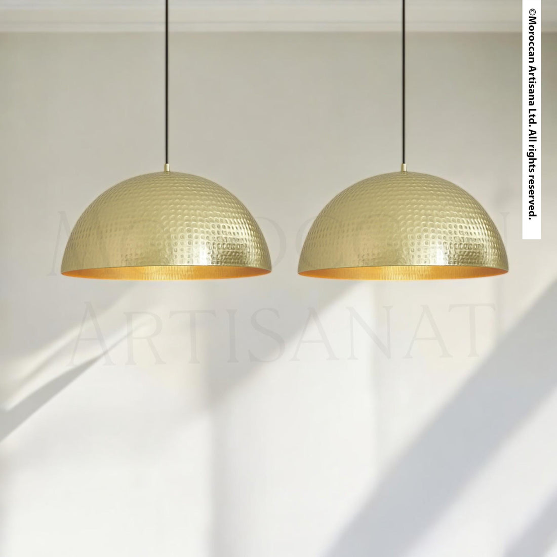 two gold-colored pendant lights hanging from the ceiling.