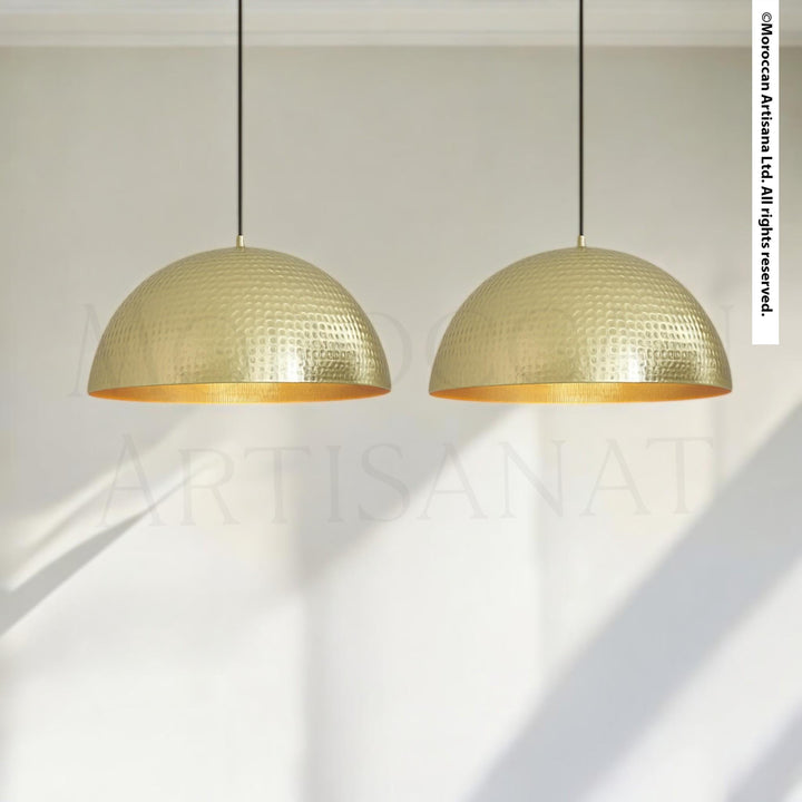 two gold-colored pendant lights hanging from the ceiling.