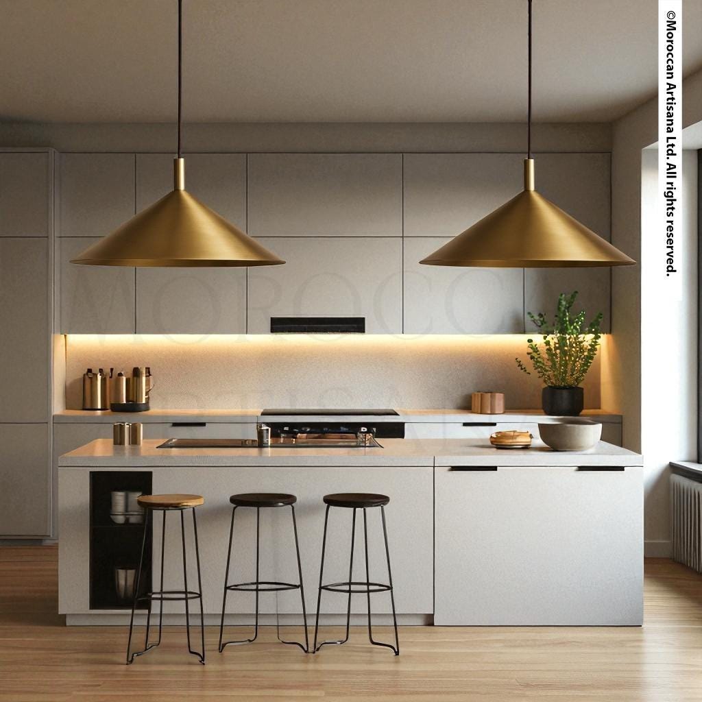 a kitchen with two pendant lights over the island