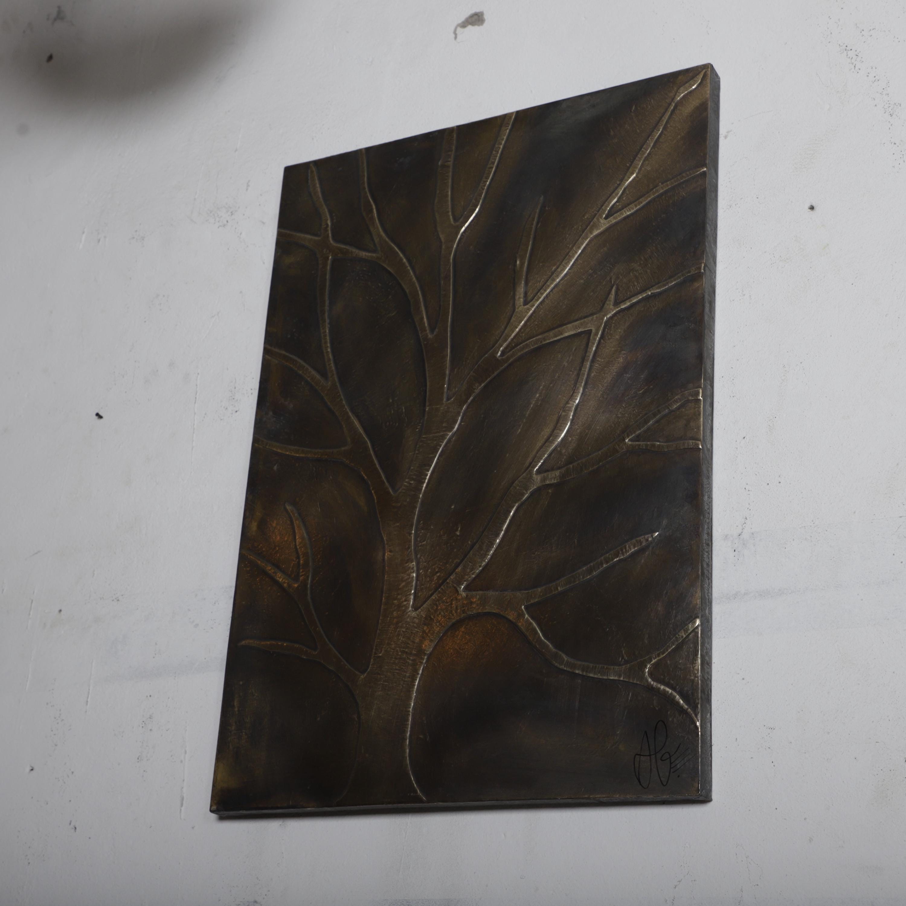 a square metal artwork depicting a tree-like design with intricate patterns and textures.