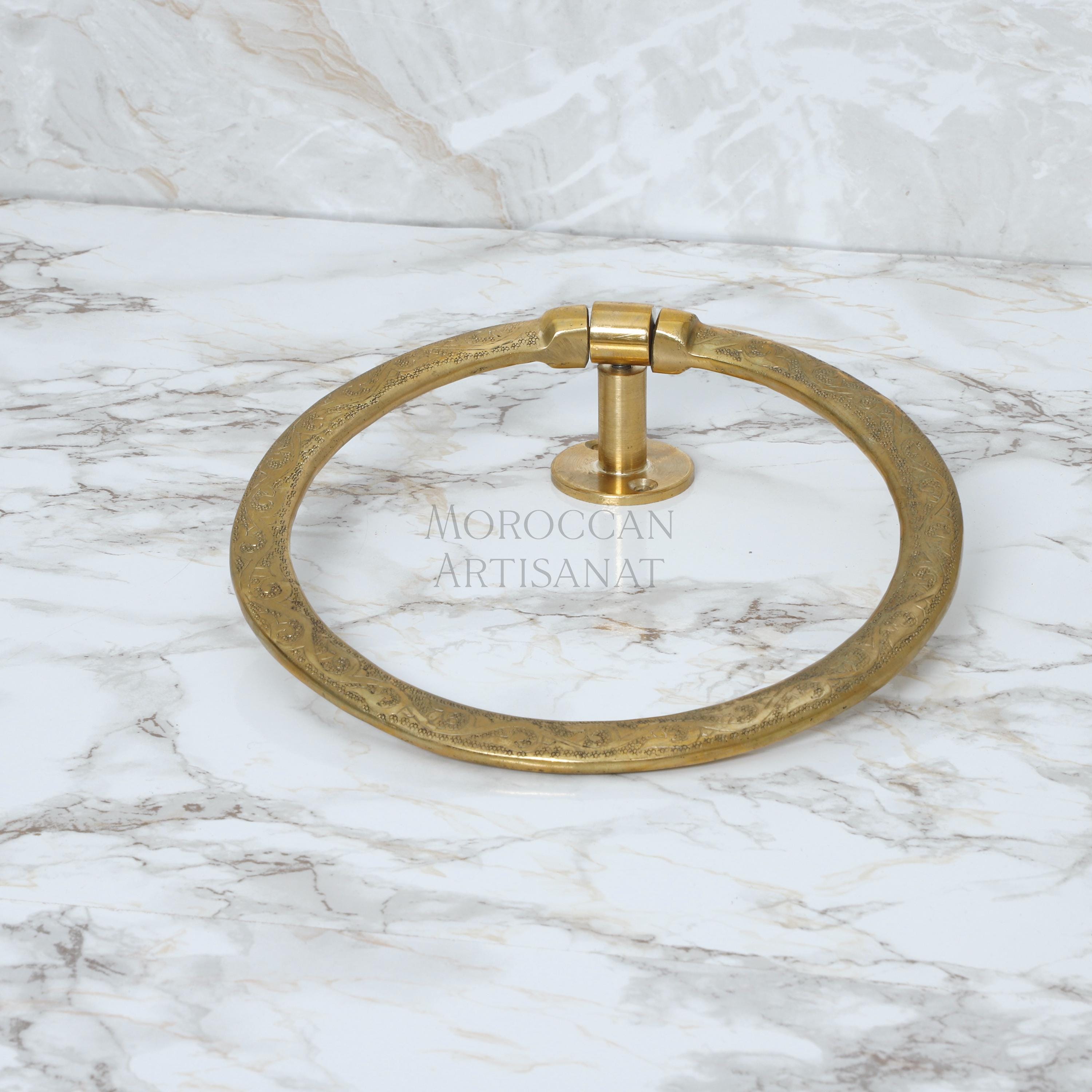 a marble counter top with a gold ring on it
