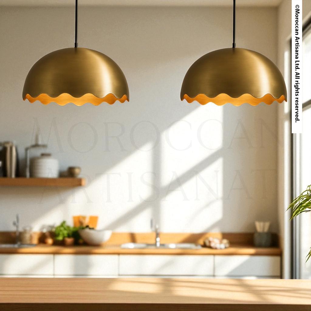 a modern kitchen with two round pendant lights hanging above a wooden countertop. The kitchen has a clean, minimalist design with white cabinets and a wooden countertop.