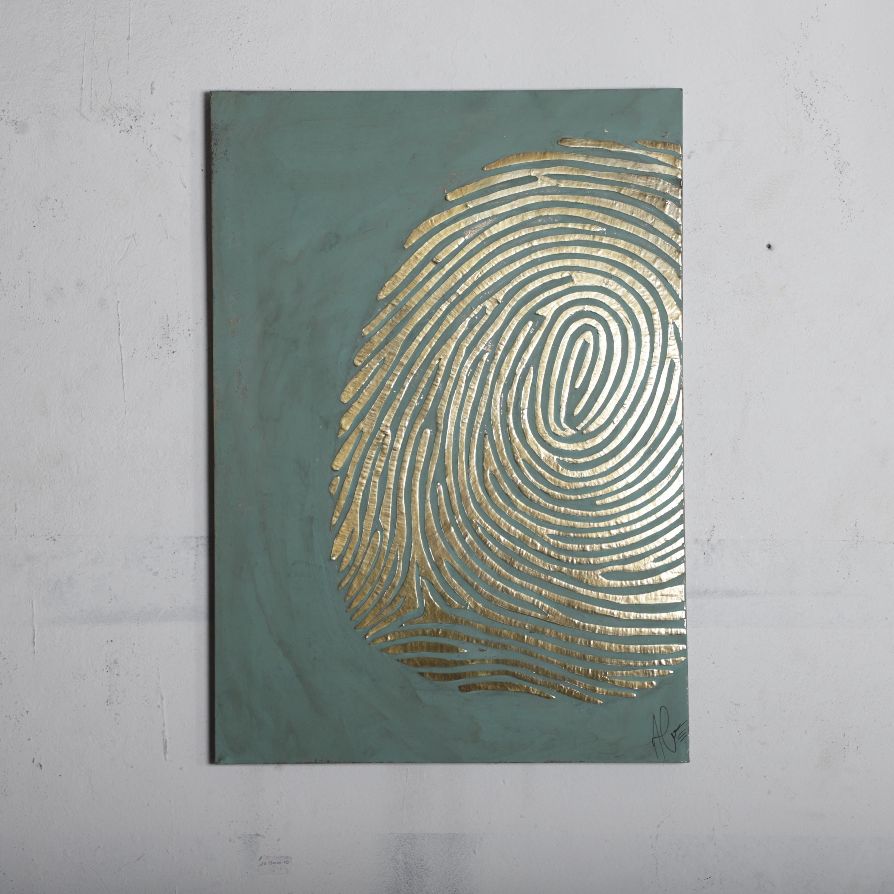 The image is a piece of art featuring a large, intricate golden fingerprint design on a dark green background.