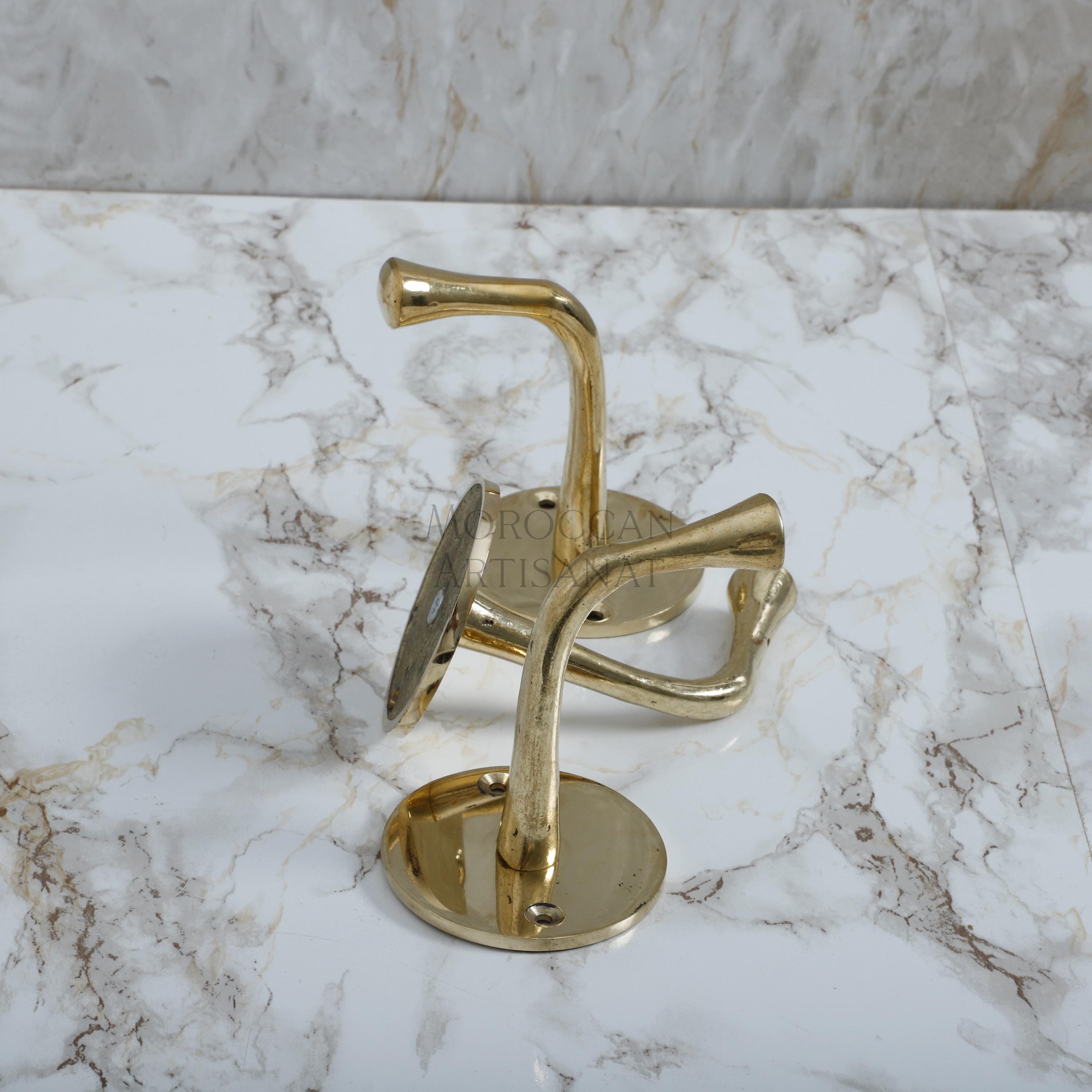 a marble counter top with a metal hook on it