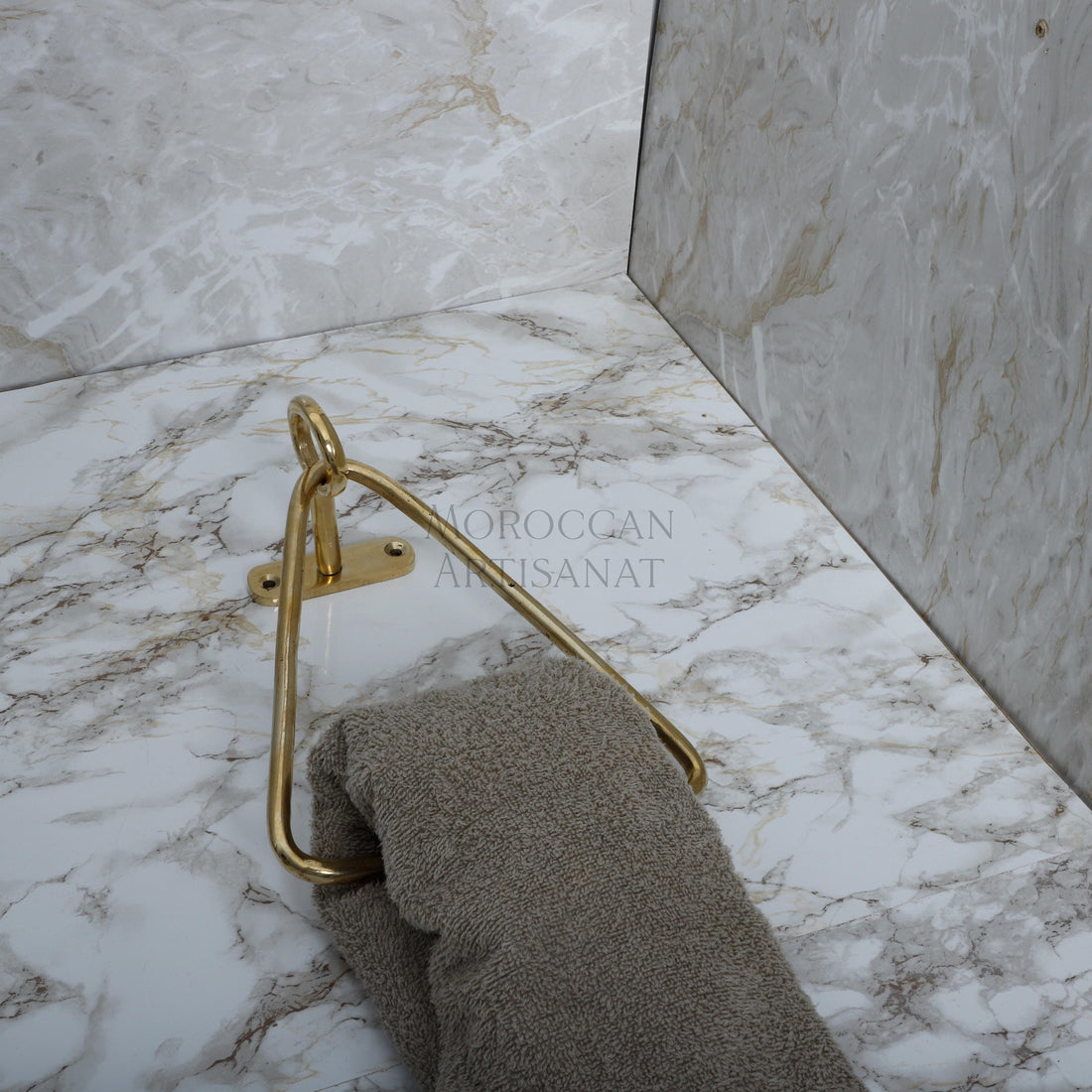 a towel and a towel rack in a bathroom