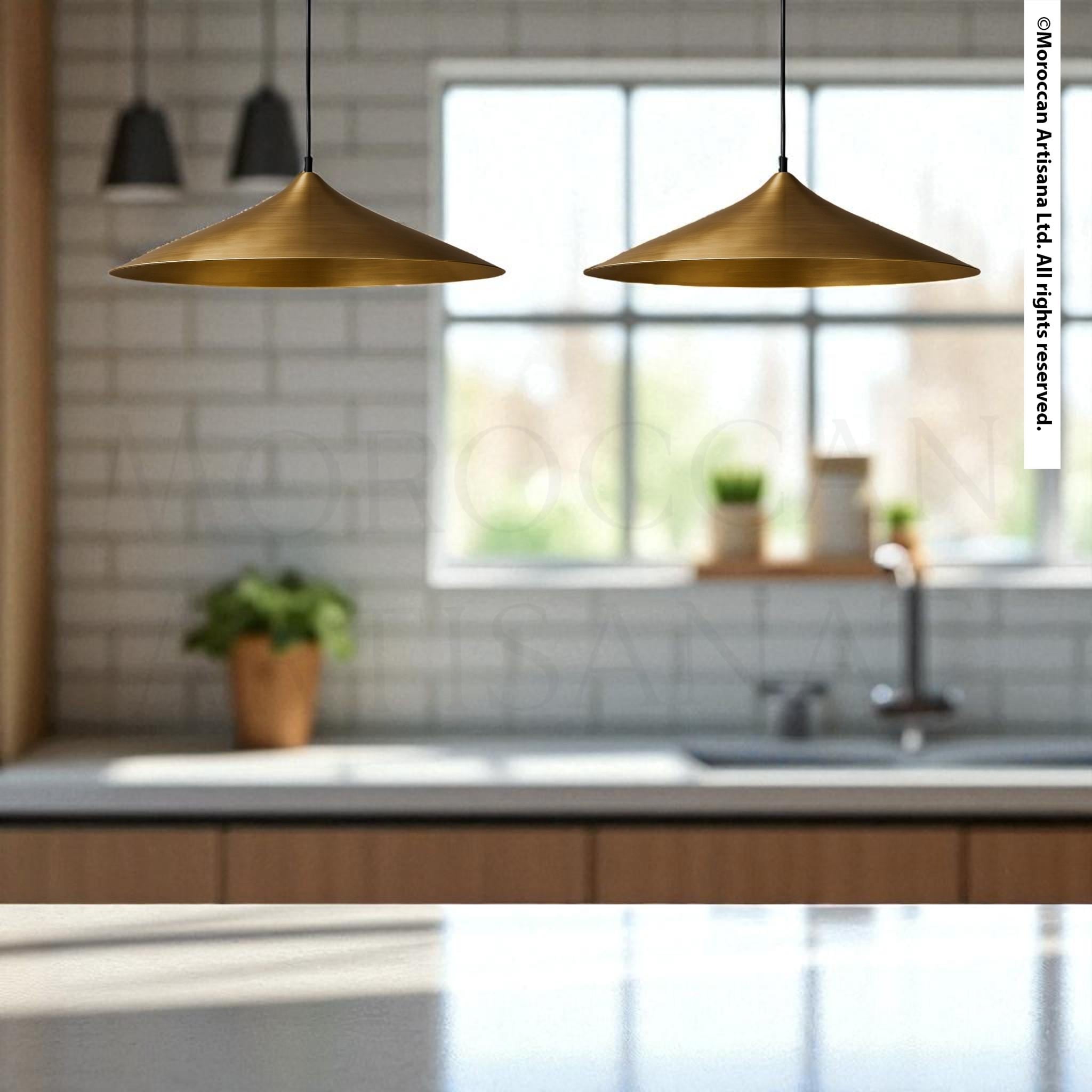 a modern kitchen with a minimalist design, featuring two pendant lights hanging above a countertop.