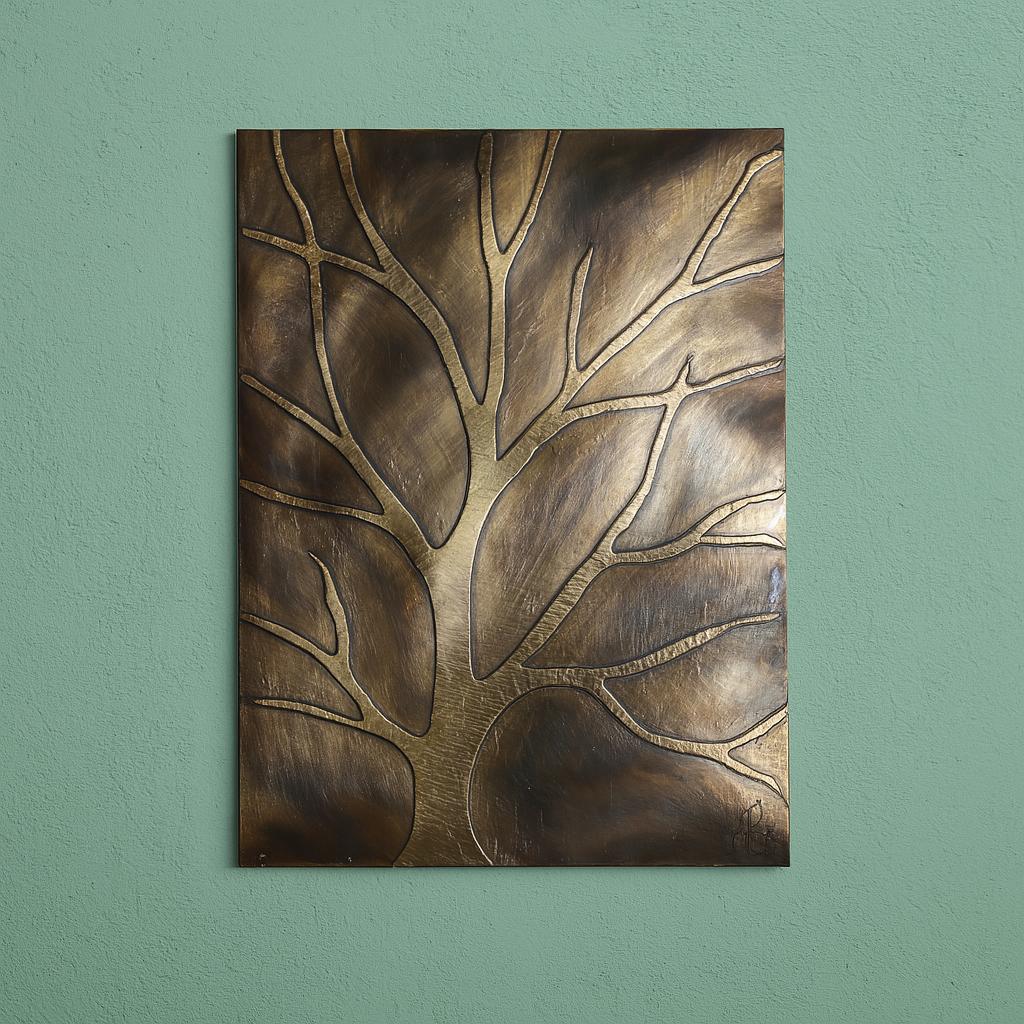 a large, metallic tree-like design on a wall, with a textured, bronze-like appearance.