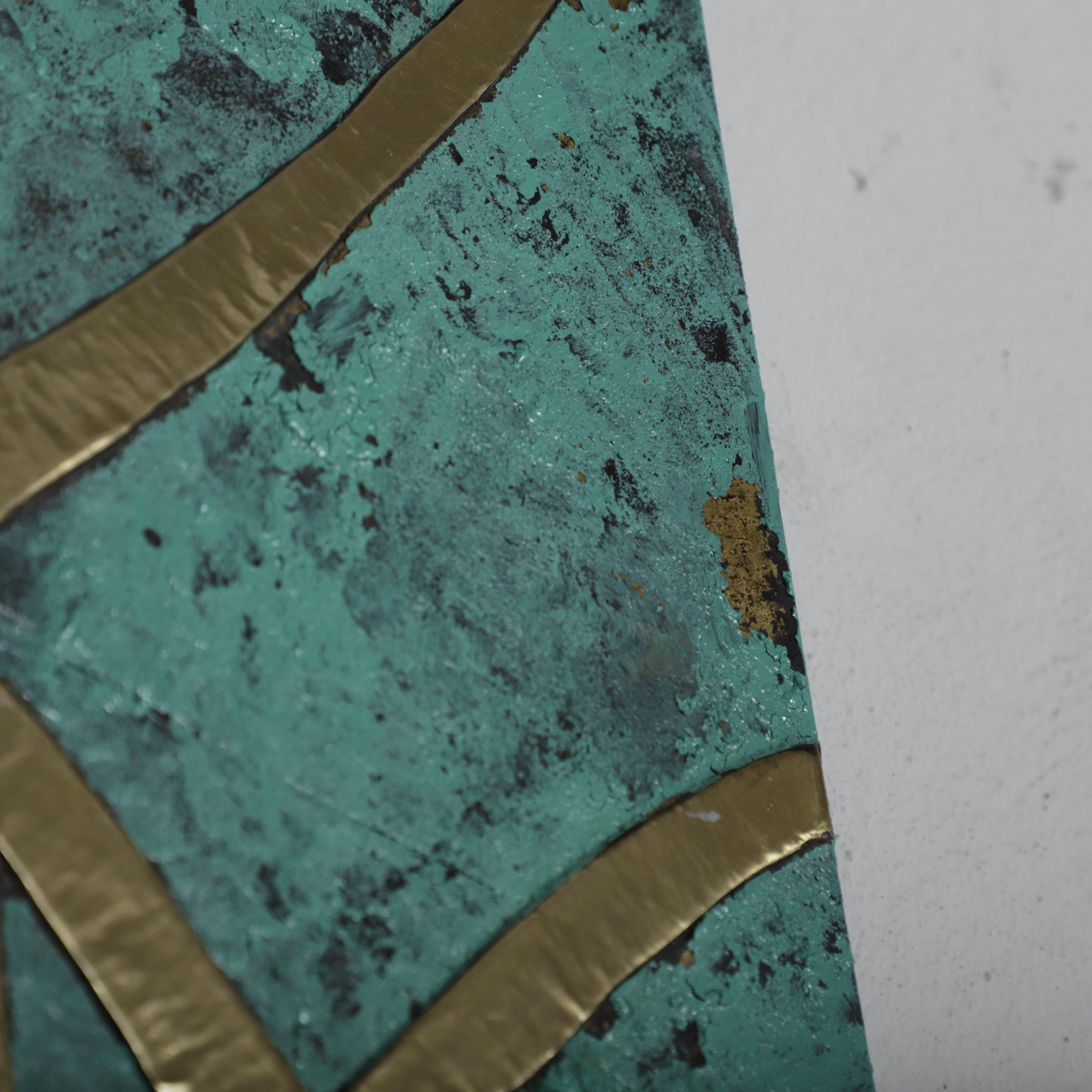 a close-up view of a textured surface with a green and gold pattern.