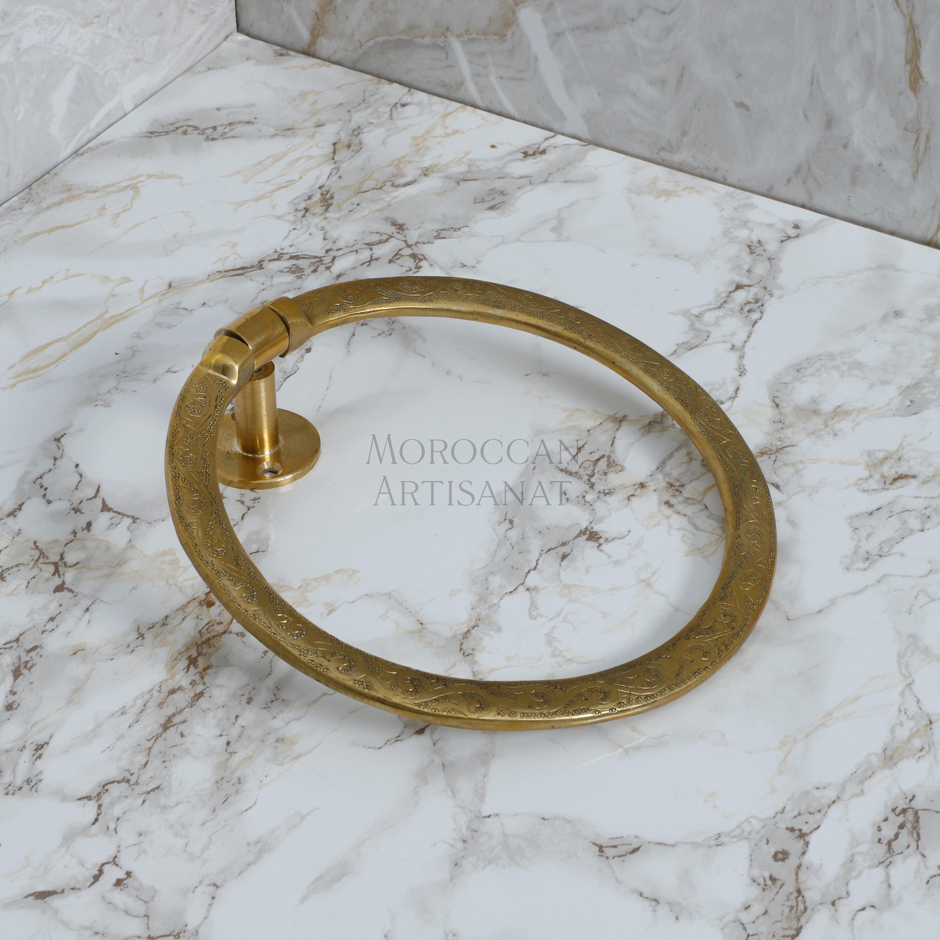 a marble counter top with a gold ring on it