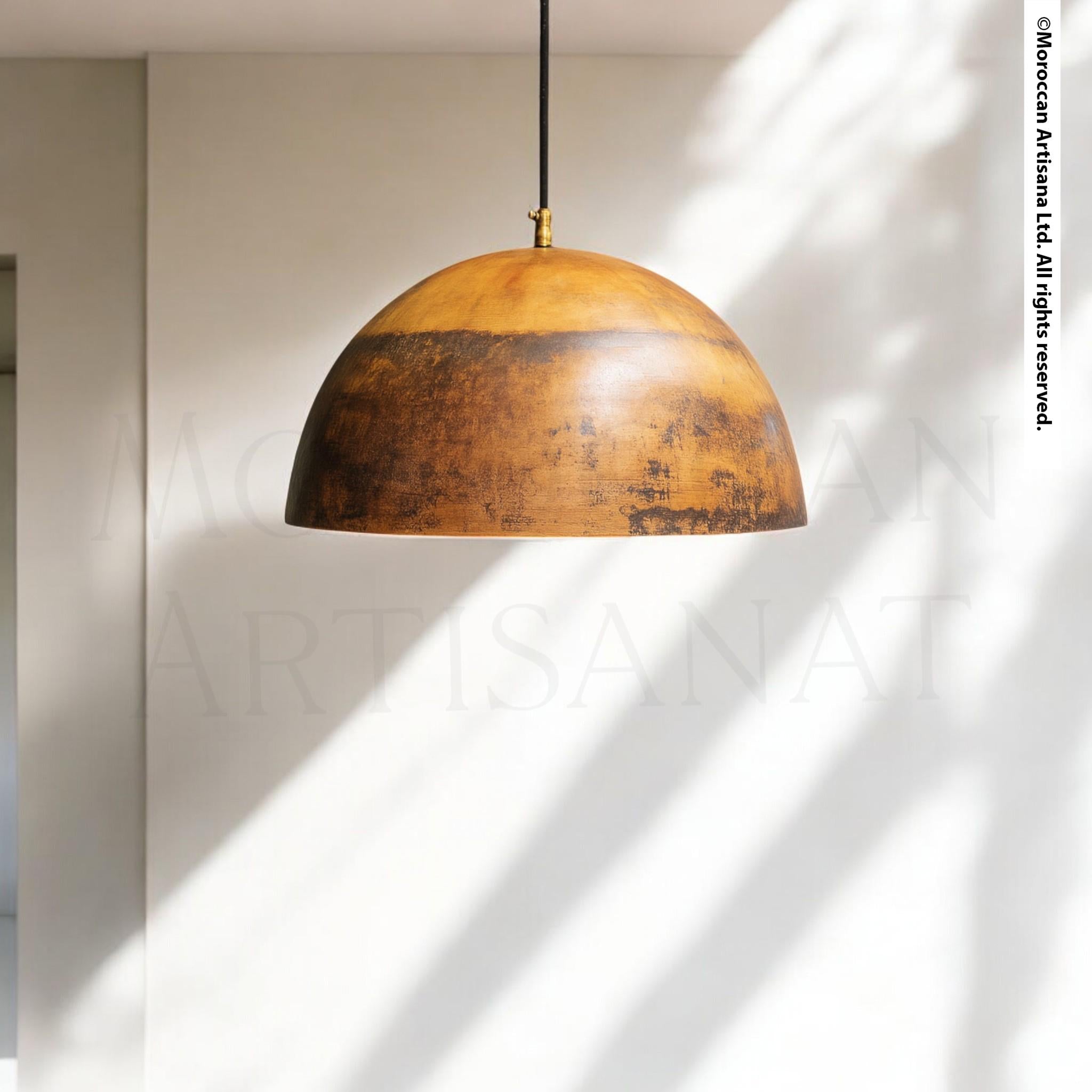 A rustic, wooden pendant lamp with a warm, earthy tone hangs from the ceiling, casting a soft glow in the room.