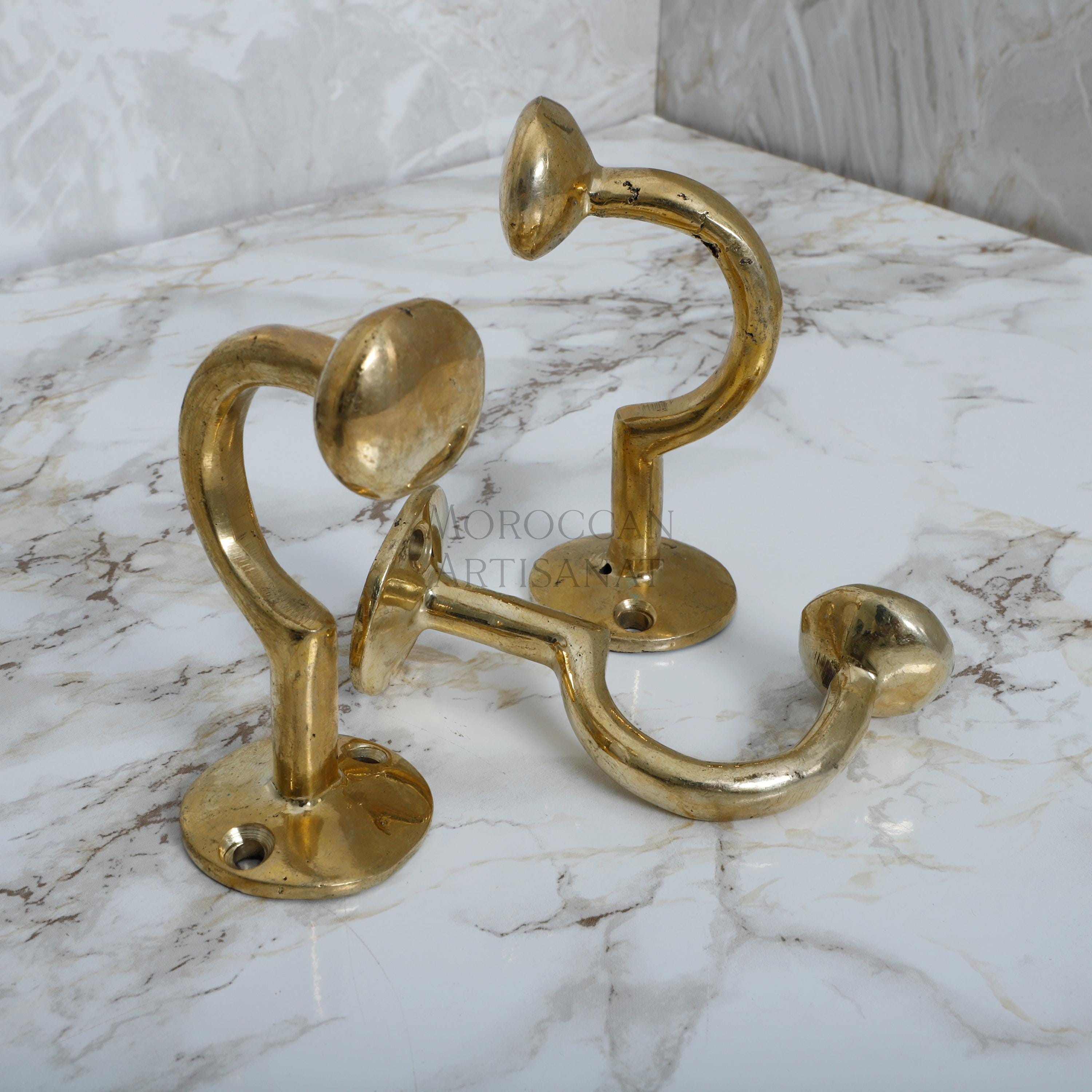 a close up of a metal object on a marble surface