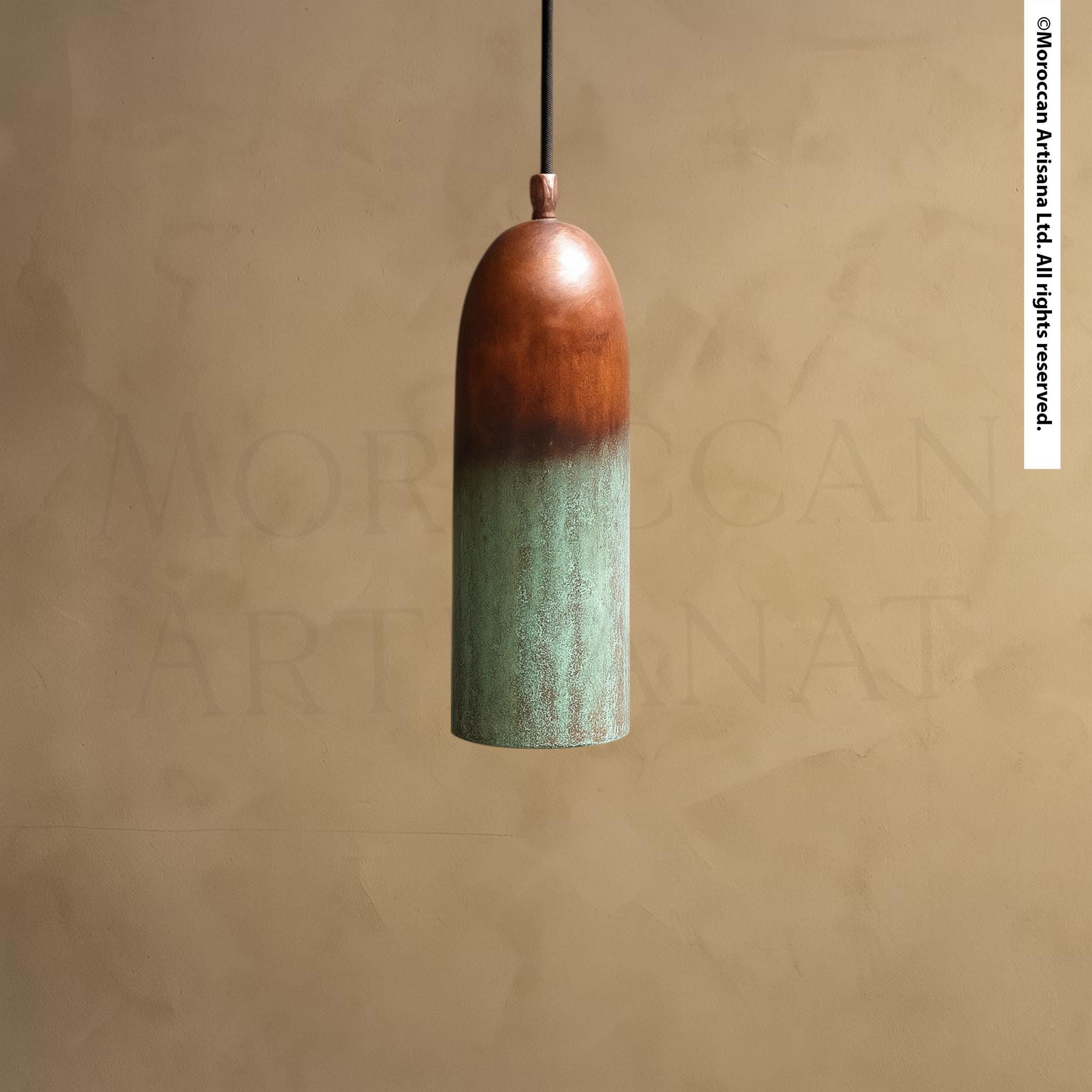 A single, hanging light fixture with a green and brown color scheme, suspended from a ceiling.