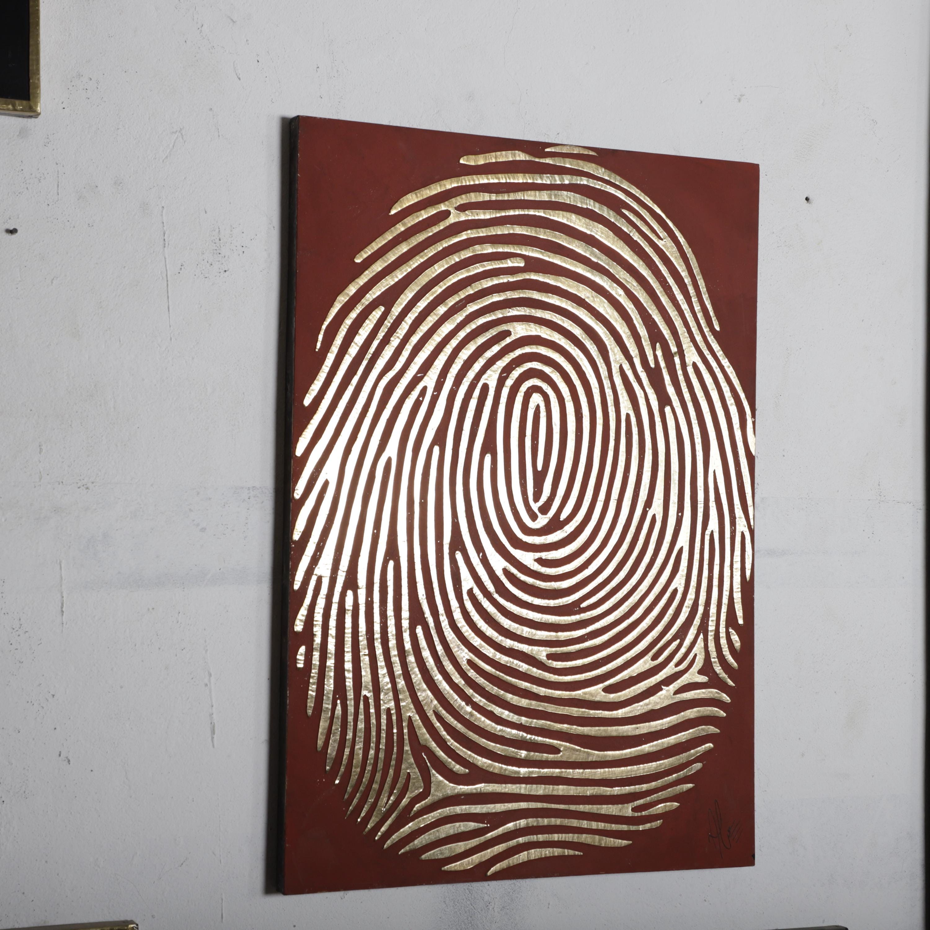 a large, intricate, and detailed fingerprint design on a red background.