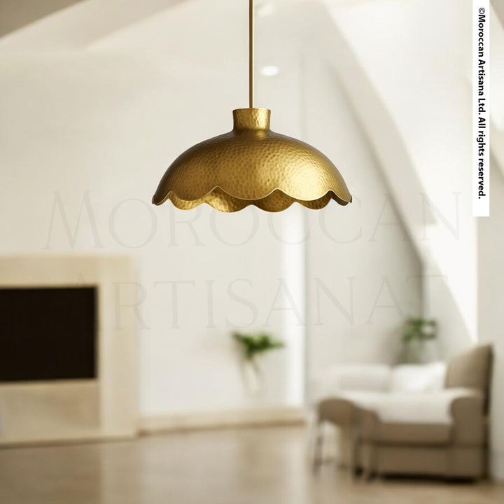 a modern, minimalist living room with a gold-colored pendant light hanging from the ceiling.