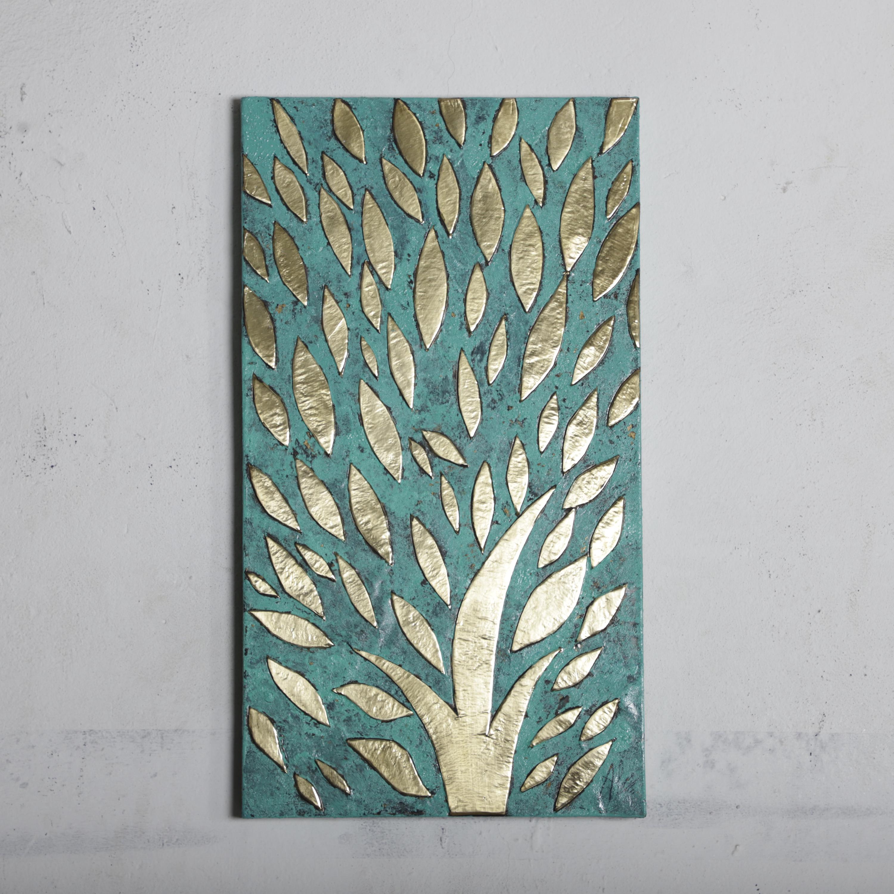The image is a rectangular piece of art featuring a tree-like design with a pattern of leaves in shades of green and gold.