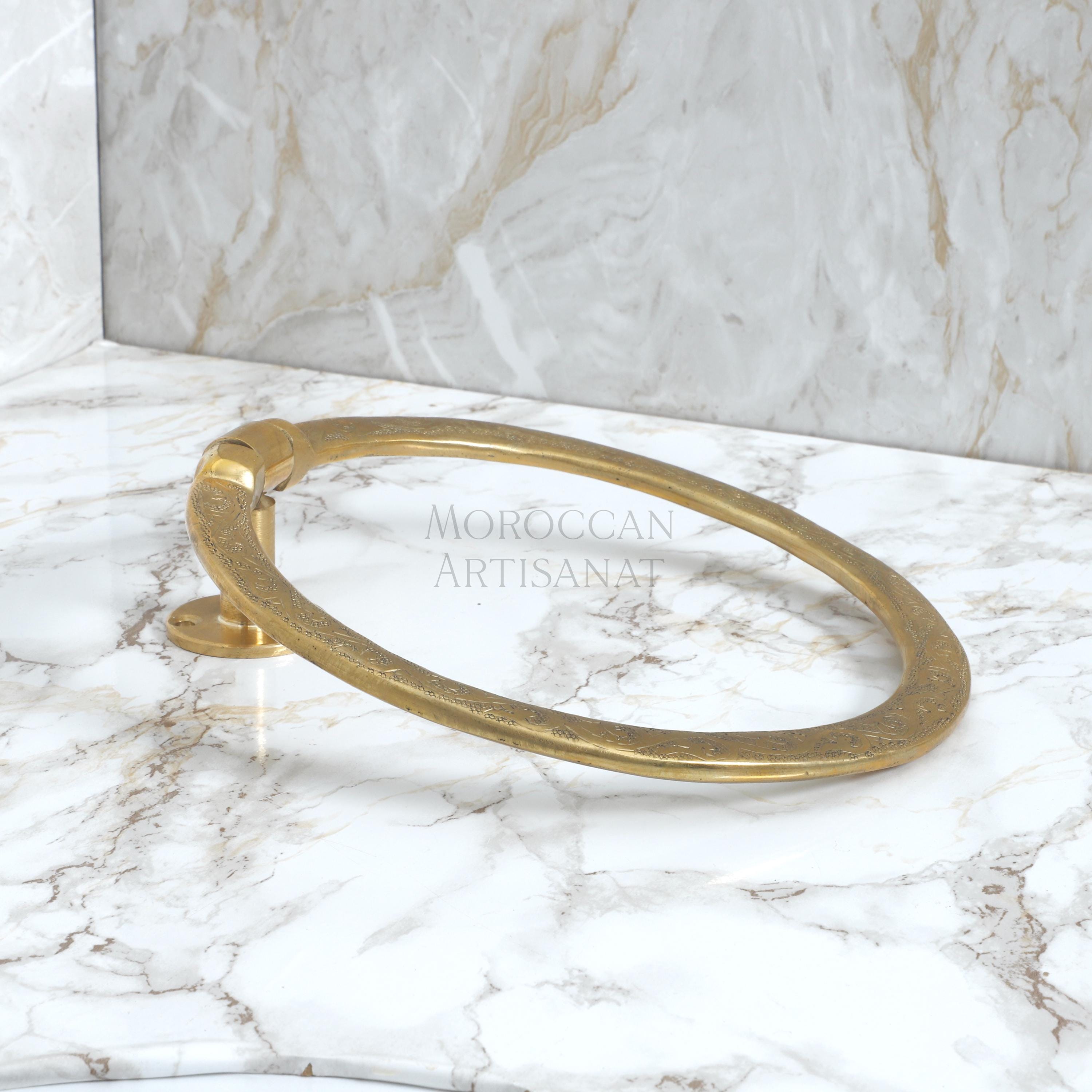 a marble counter top with a gold ring on it