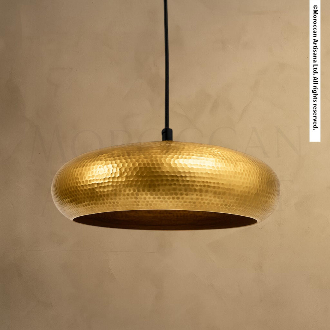 A gold-colored pendant light fixture hangs from the ceiling, casting a warm glow in the room.