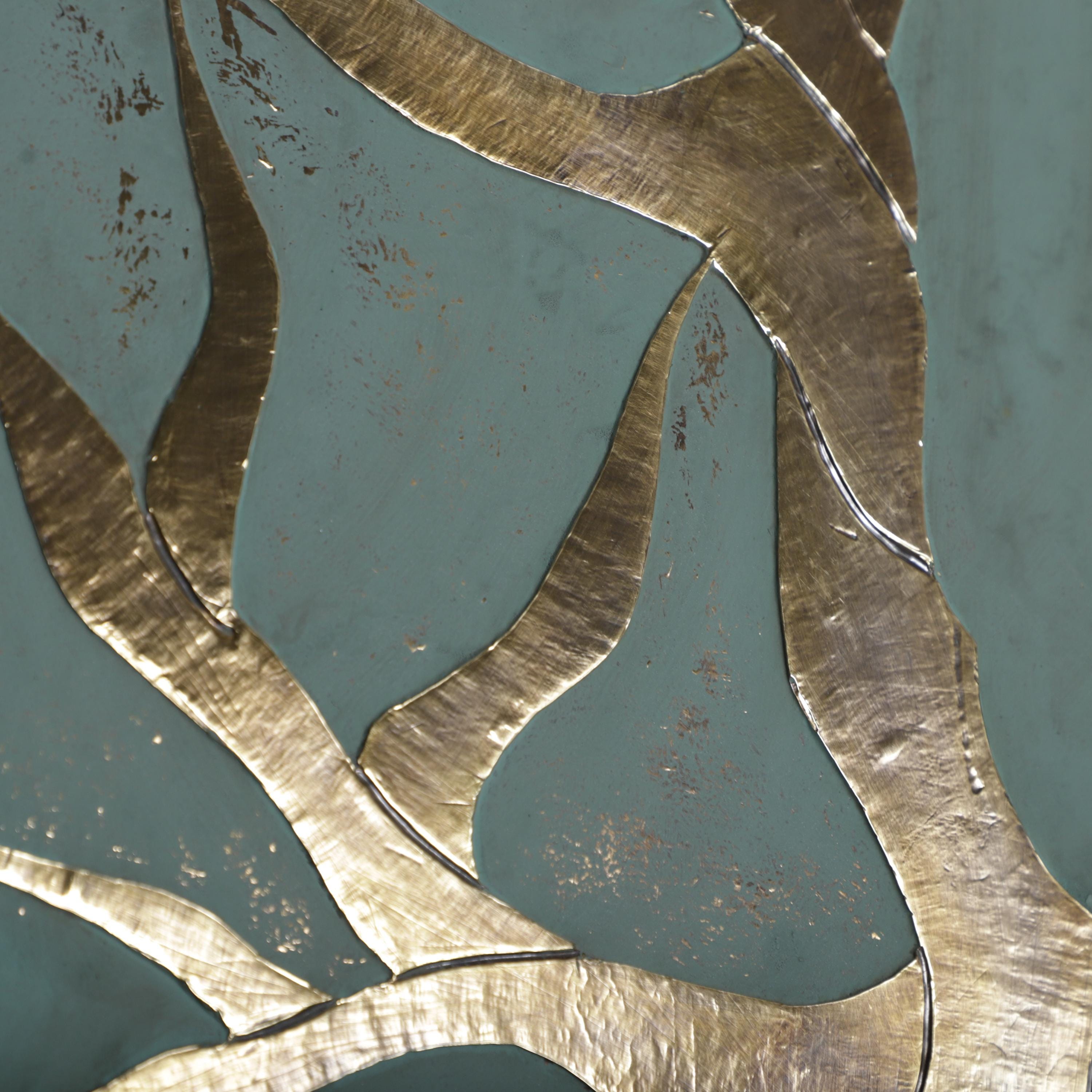 a close-up view of a metallic surface with a textured, abstract design. The surface appears to be a combination of gold and blue colors, with a pattern of curved lines and shapes that create a sense of movement and depth. The image does not contain any discernible objects or actions, and there are no specific actions or movements captured. The overall composition is simple and minimalist, focusing on the interplay of the metallic surface and its surroundings.