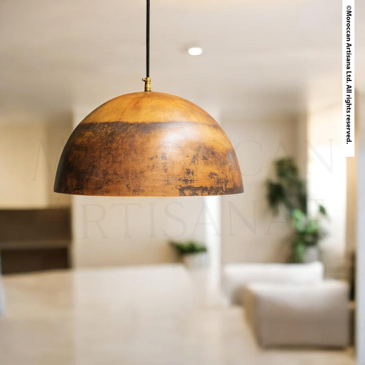 a modern, minimalist living room with a large, round, wooden pendant light hanging from the ceiling.
