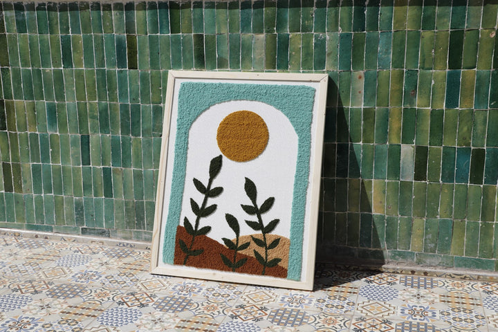 Framed textile wall art with abstract fabric design.