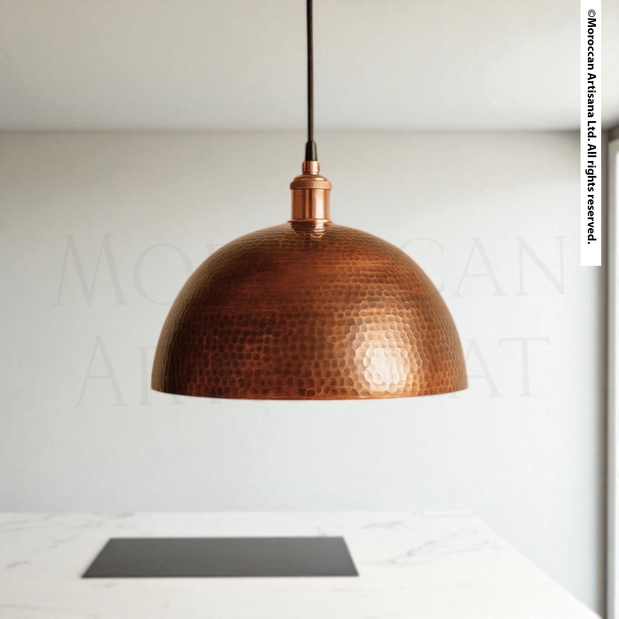 Hand-hammered copper dome pendant light with warm reflective finish, Moroccan artisan ceiling fixture for rustic or modern interiors