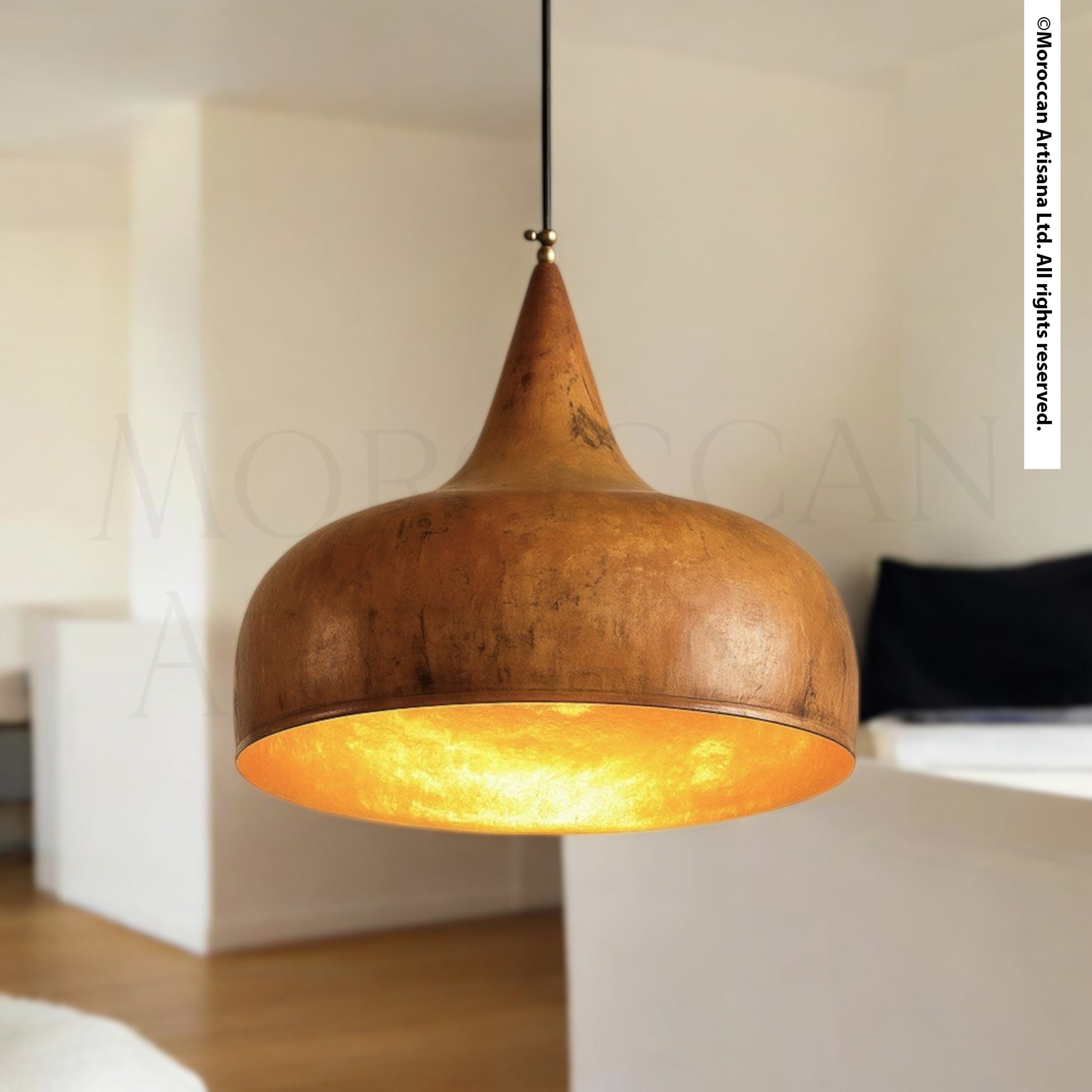 Handcrafted rustic brass pendant light with warm patina finish and tapered dome design, Moroccan artisan lighting hanging from ceiling