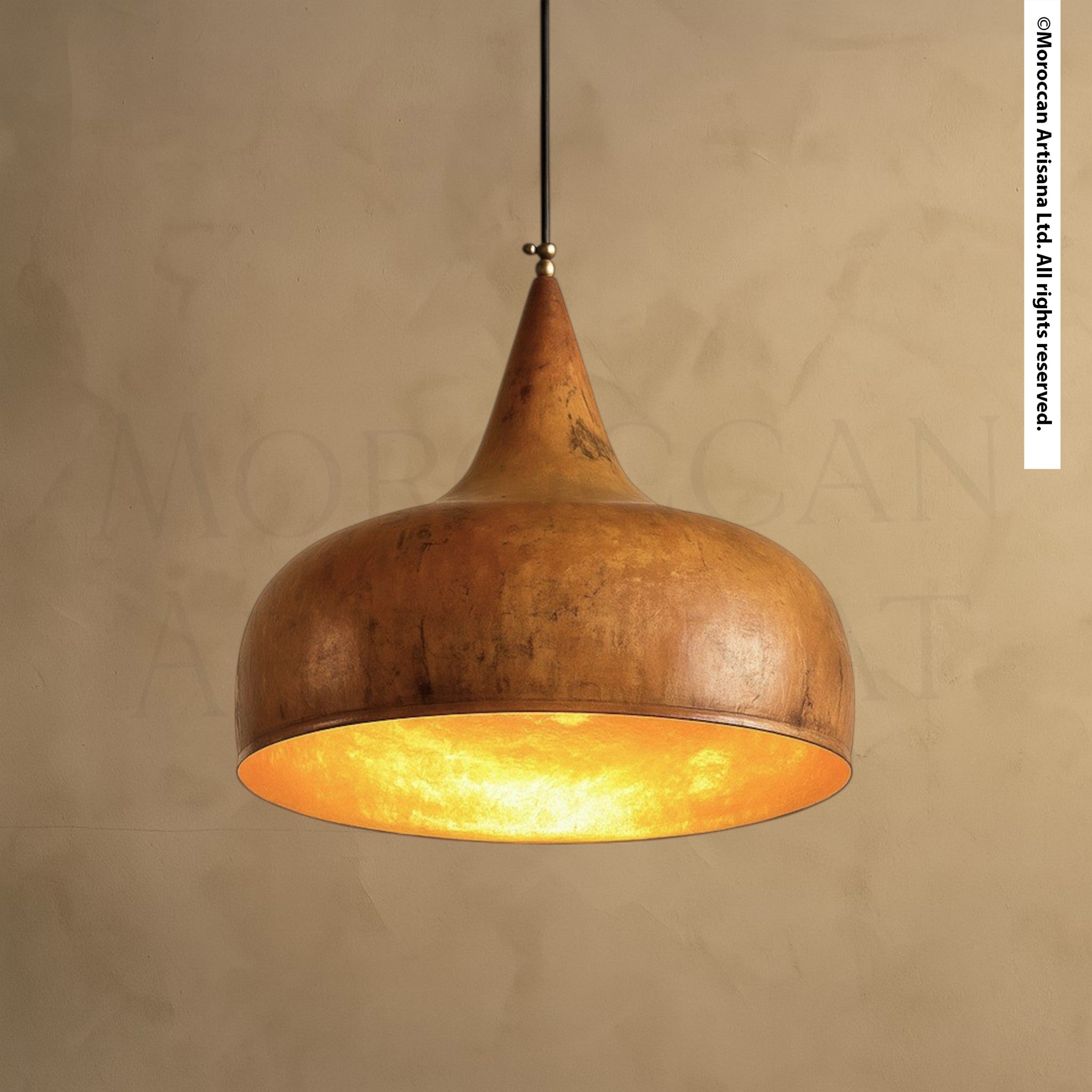 Handcrafted rustic brass pendant light with warm patina finish and tapered dome design, Moroccan artisan lighting hanging from ceiling