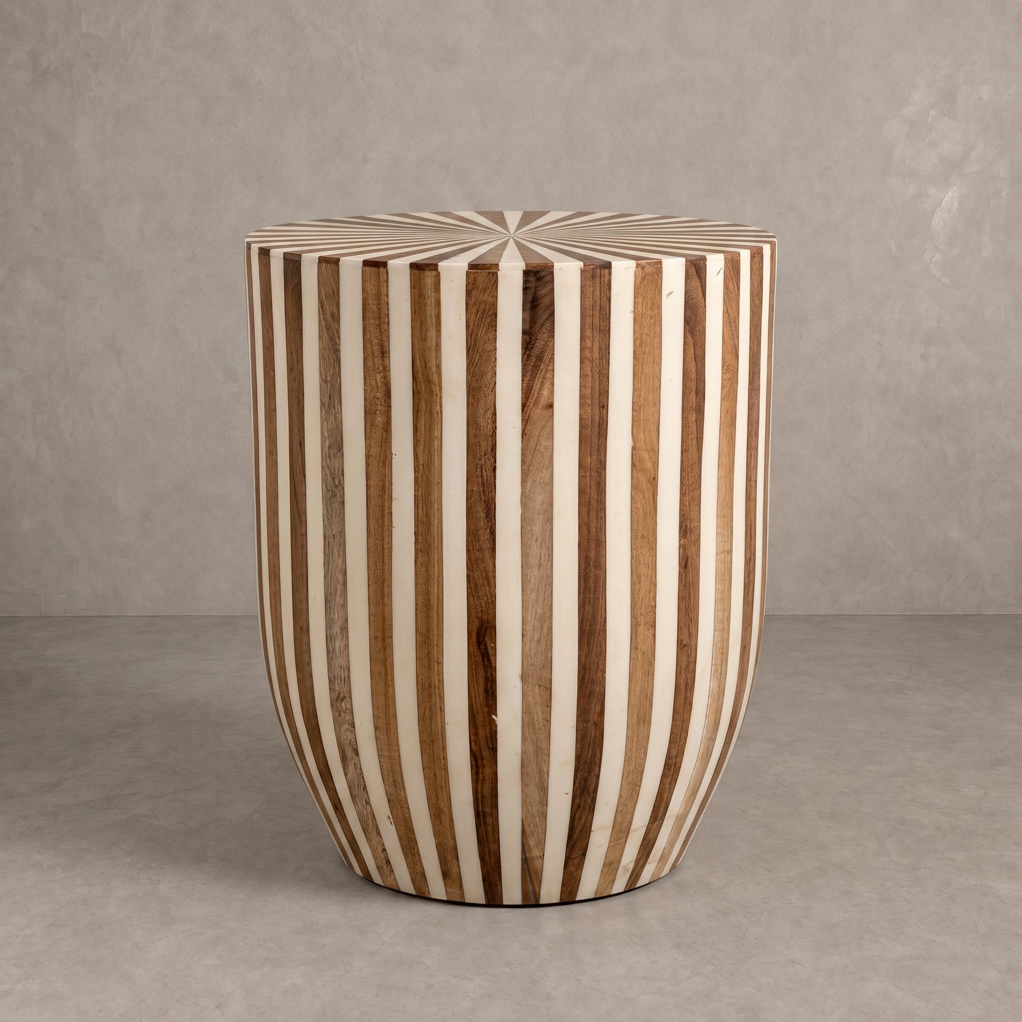 Rustic Moroccan walnut wood side table with dark resin inlay in a modern living room