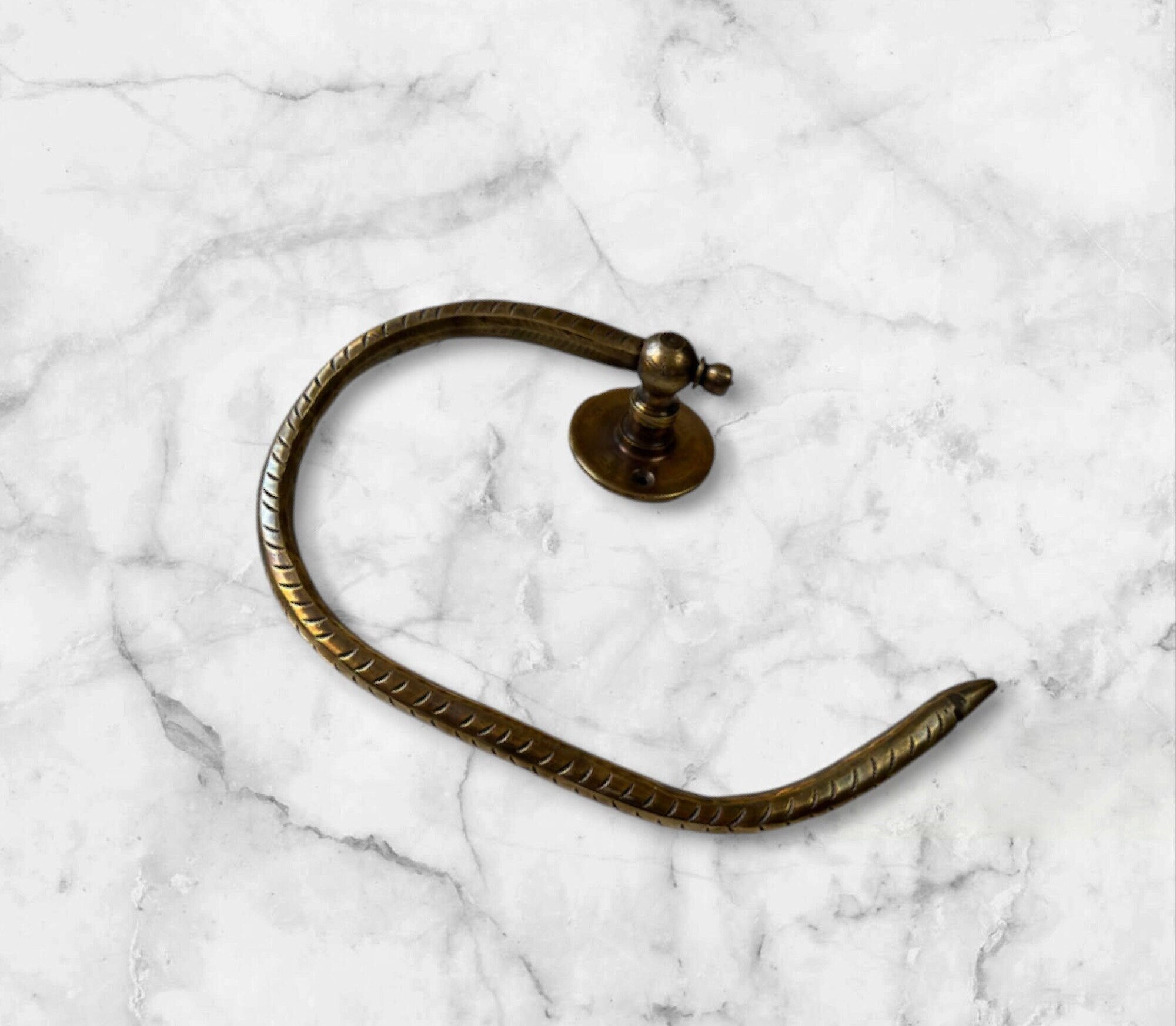 Modern toilet paper holder with open-ended design for easy roll changes