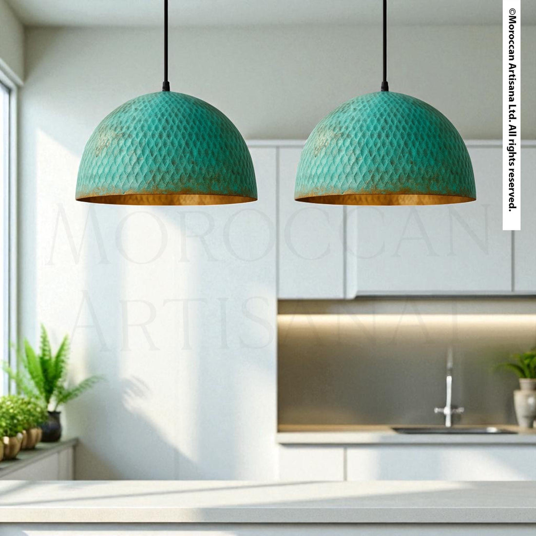 two green pendant lights hanging from the ceiling in a kitchen setting.