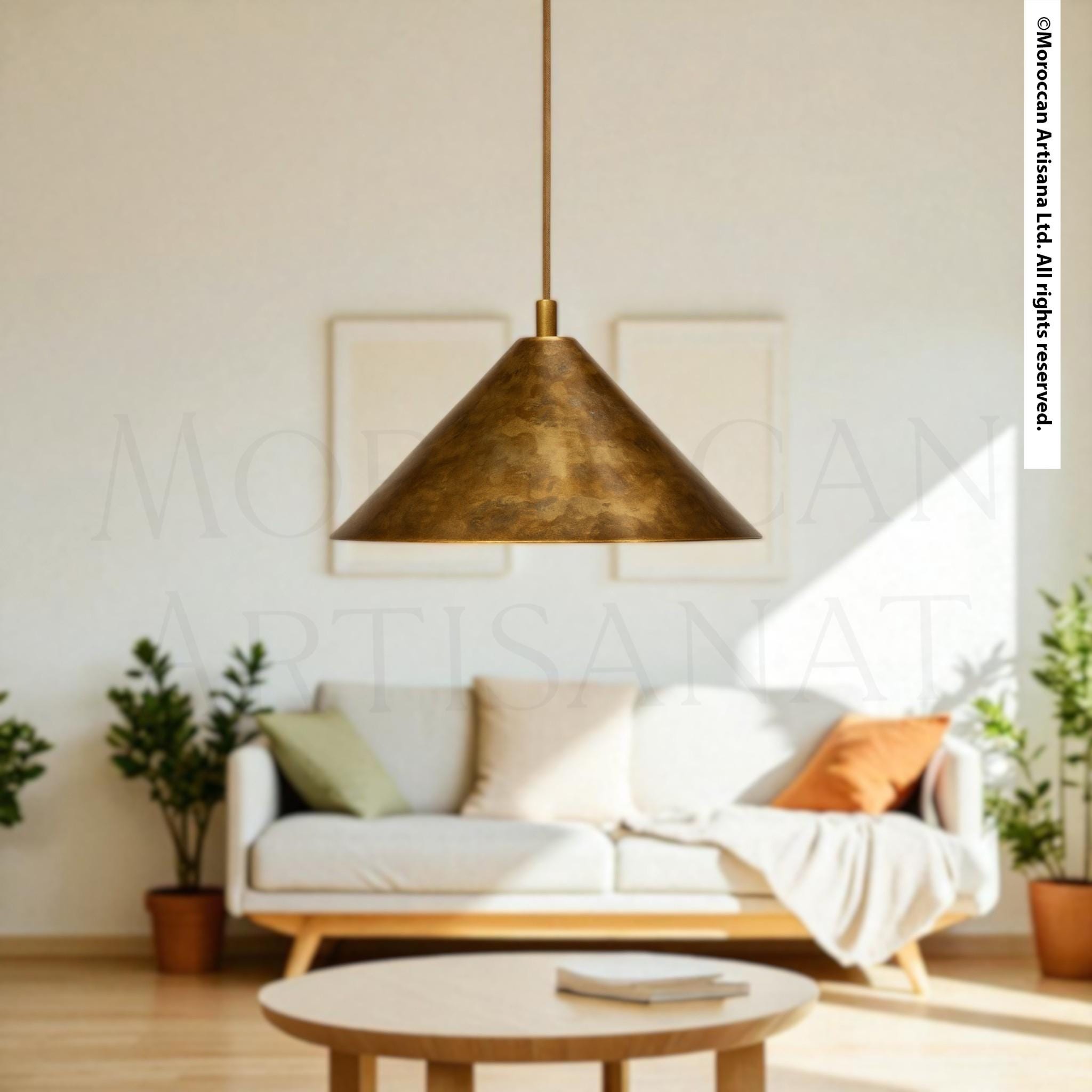 a modern living room with a white sofa, a wooden coffee table, and a pendant light hanging above the sofa.