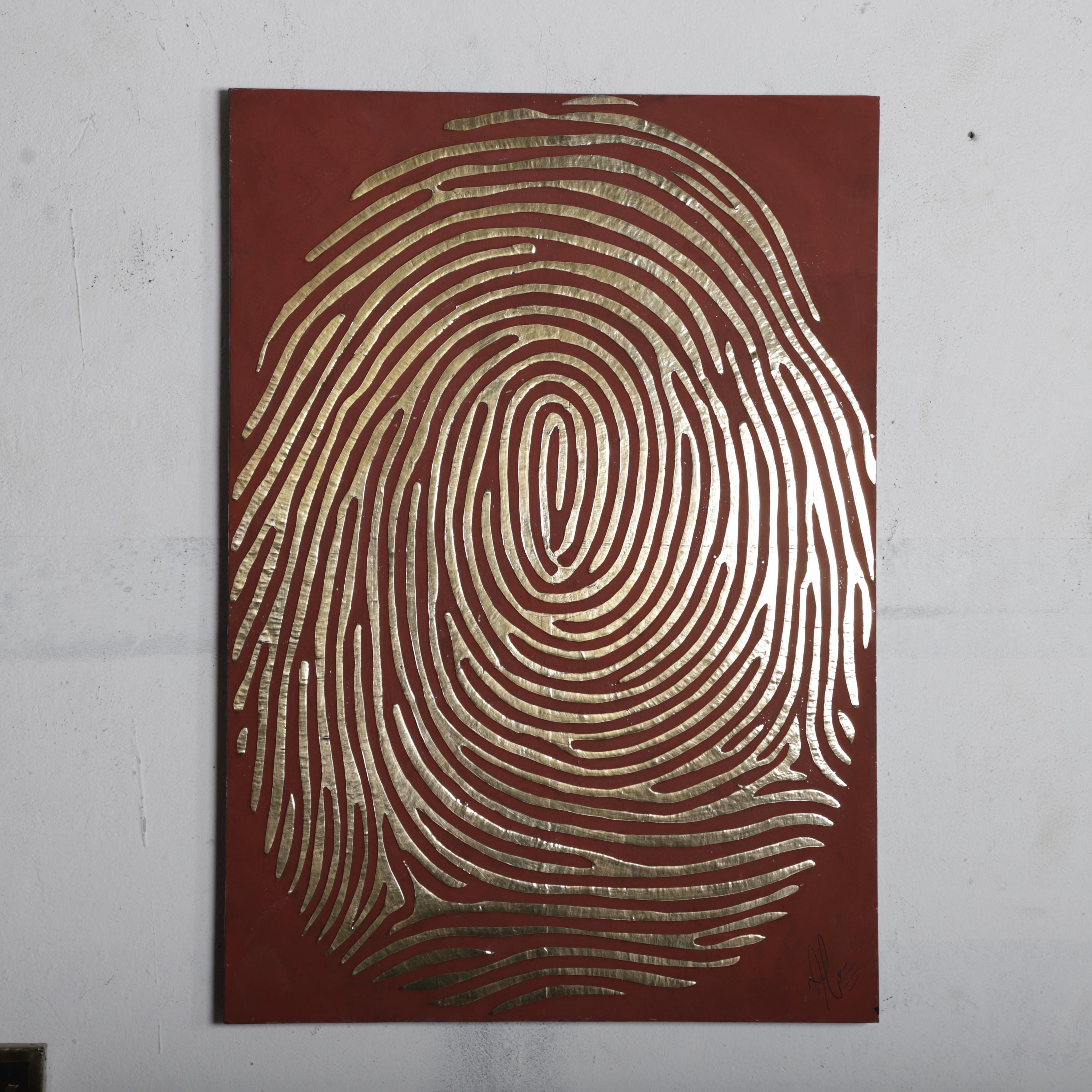 a large, intricate, and detailed fingerprint design on a red background.
