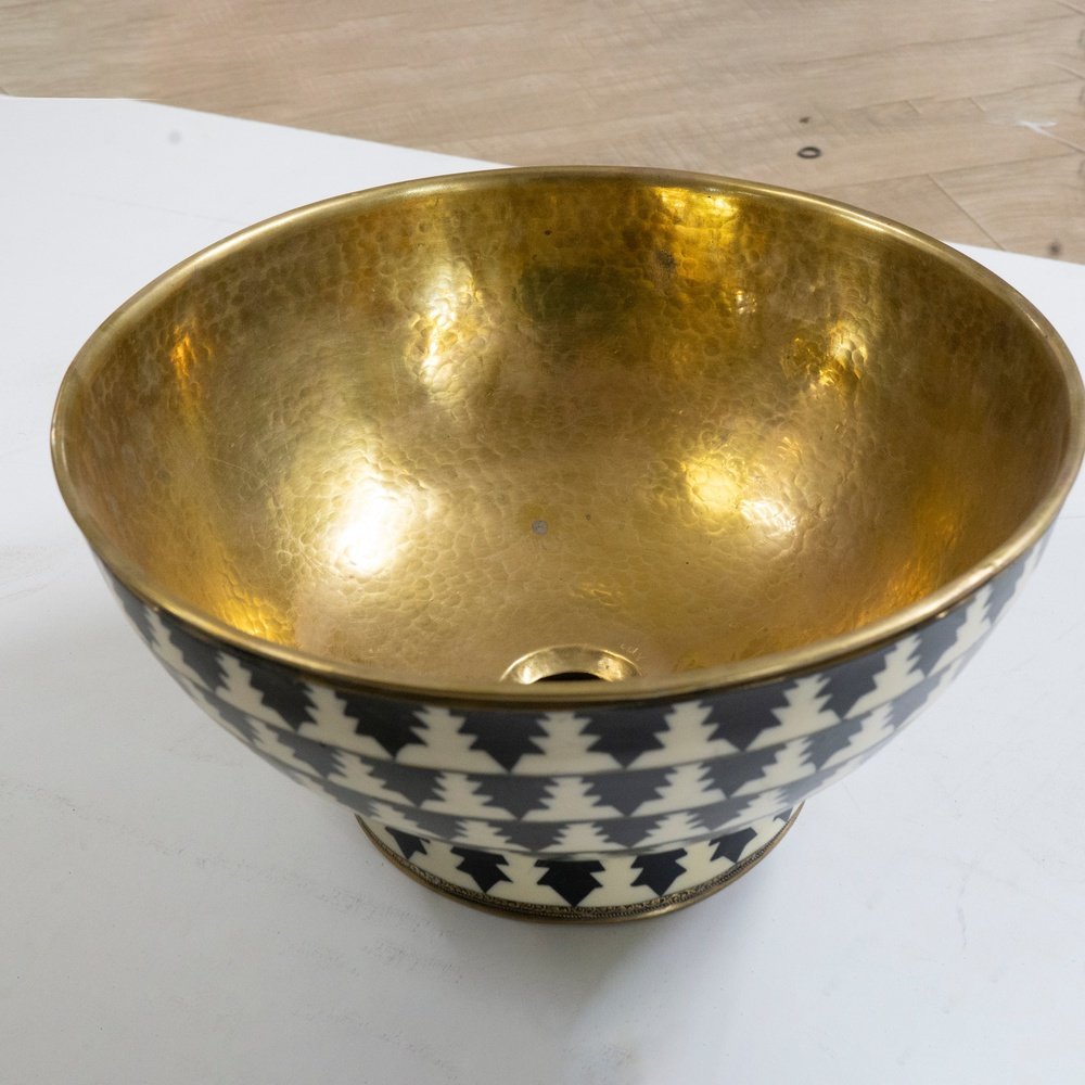 Elegant brass vessel sink with a warm finish for a luxurious bathroom decor