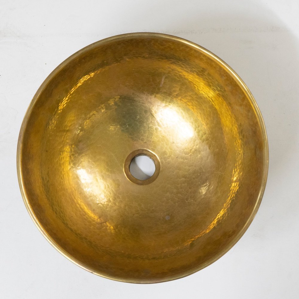 Elegant brass vessel sink with a warm finish for a luxurious bathroom decor