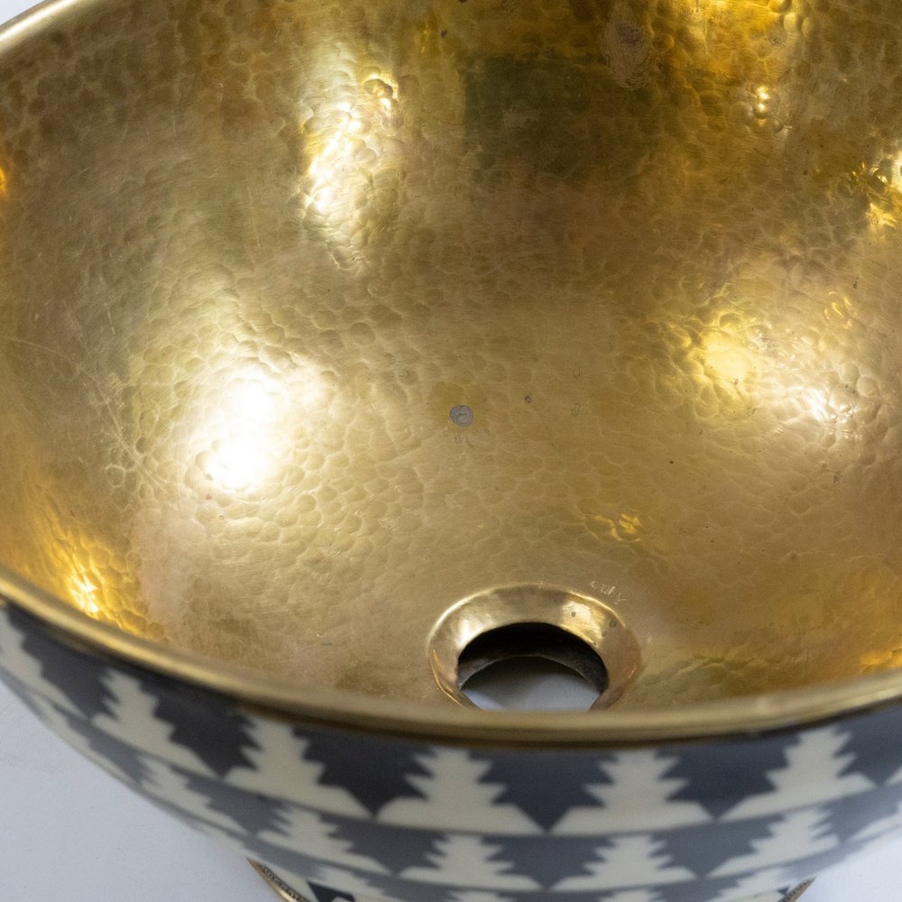 Elegant brass vessel sink with a warm finish for a luxurious bathroom decor