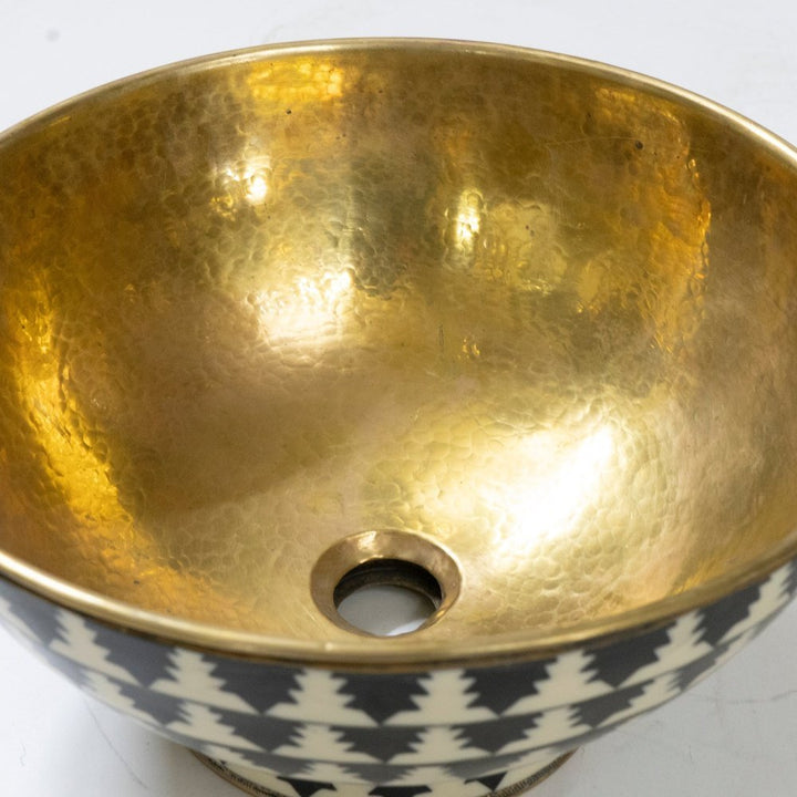 Elegant brass vessel sink with a warm finish for a luxurious bathroom decor