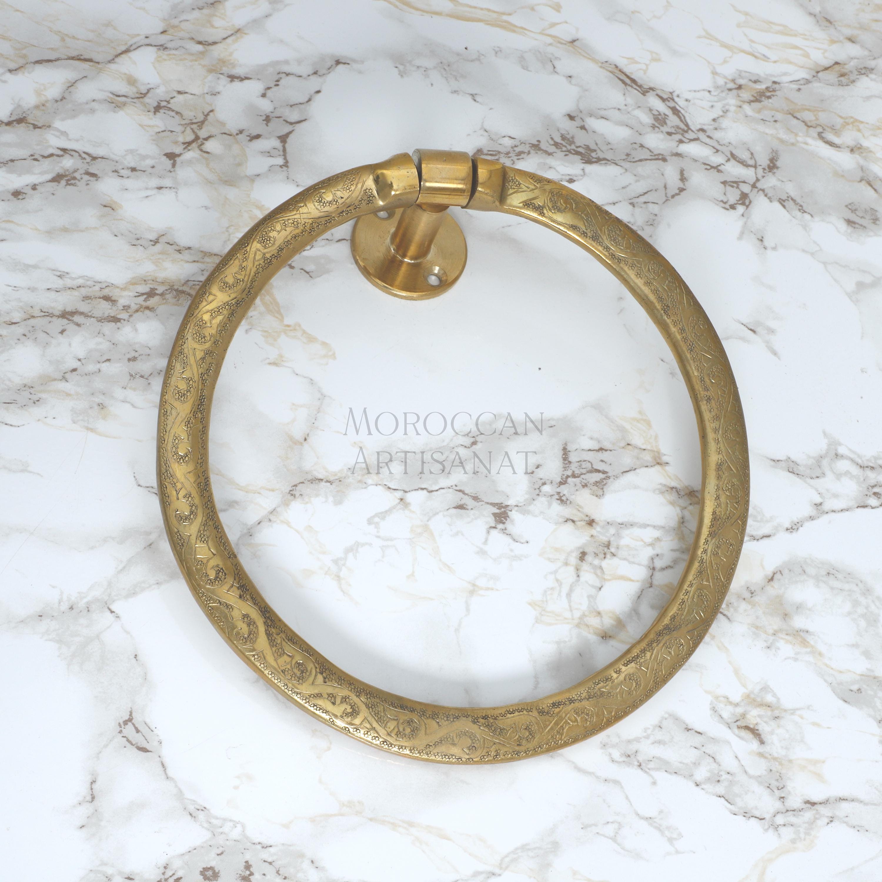 a marble counter top with a brass ring on it