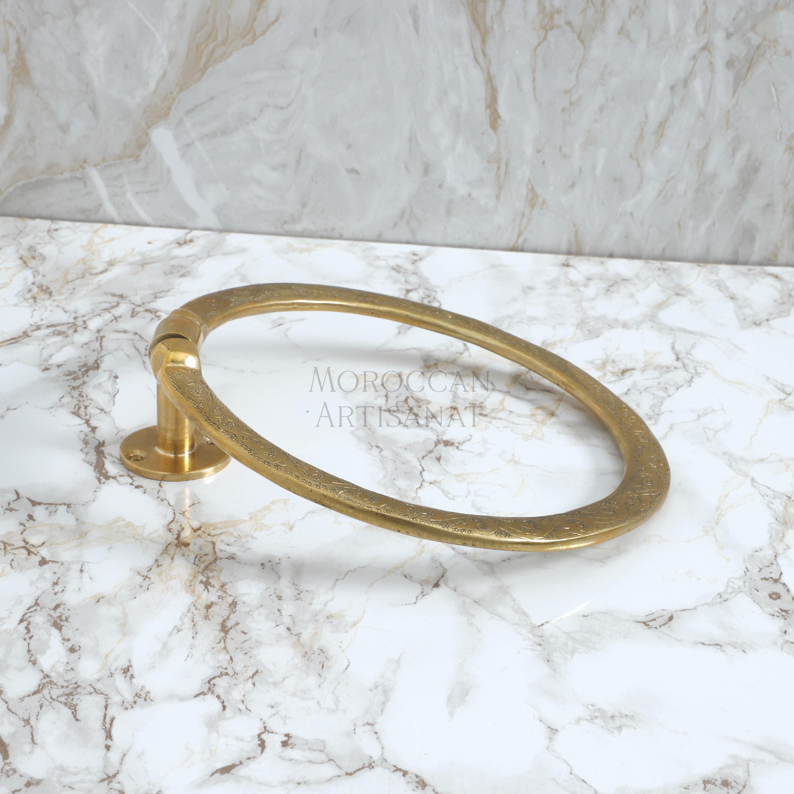 a marble counter top with a gold ring on it