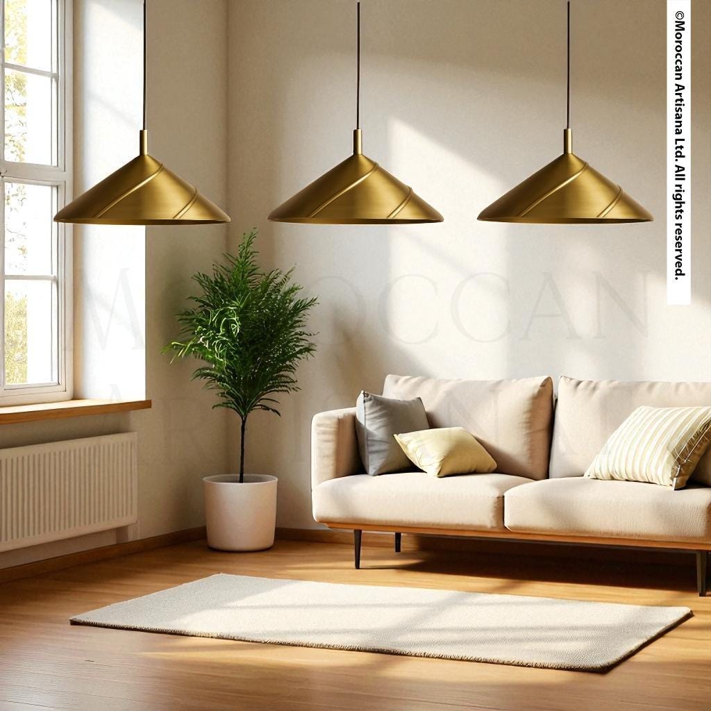 a modern living room with a beige sofa, a large potted plant, and three hanging pendant lights.