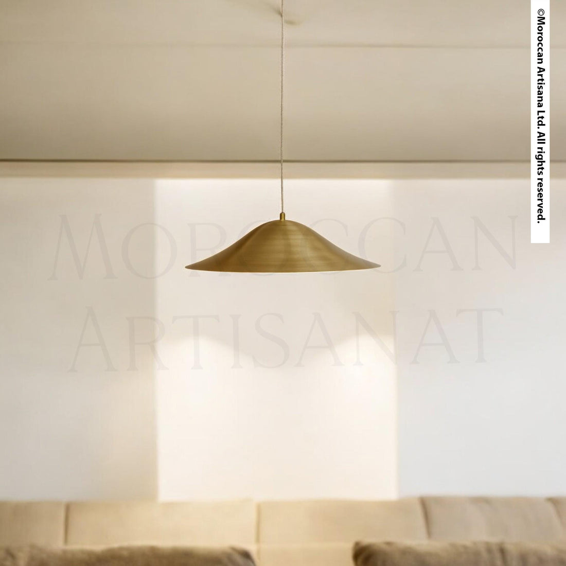 A gold-colored pendant light hangs from the ceiling, casting a warm glow in the room.