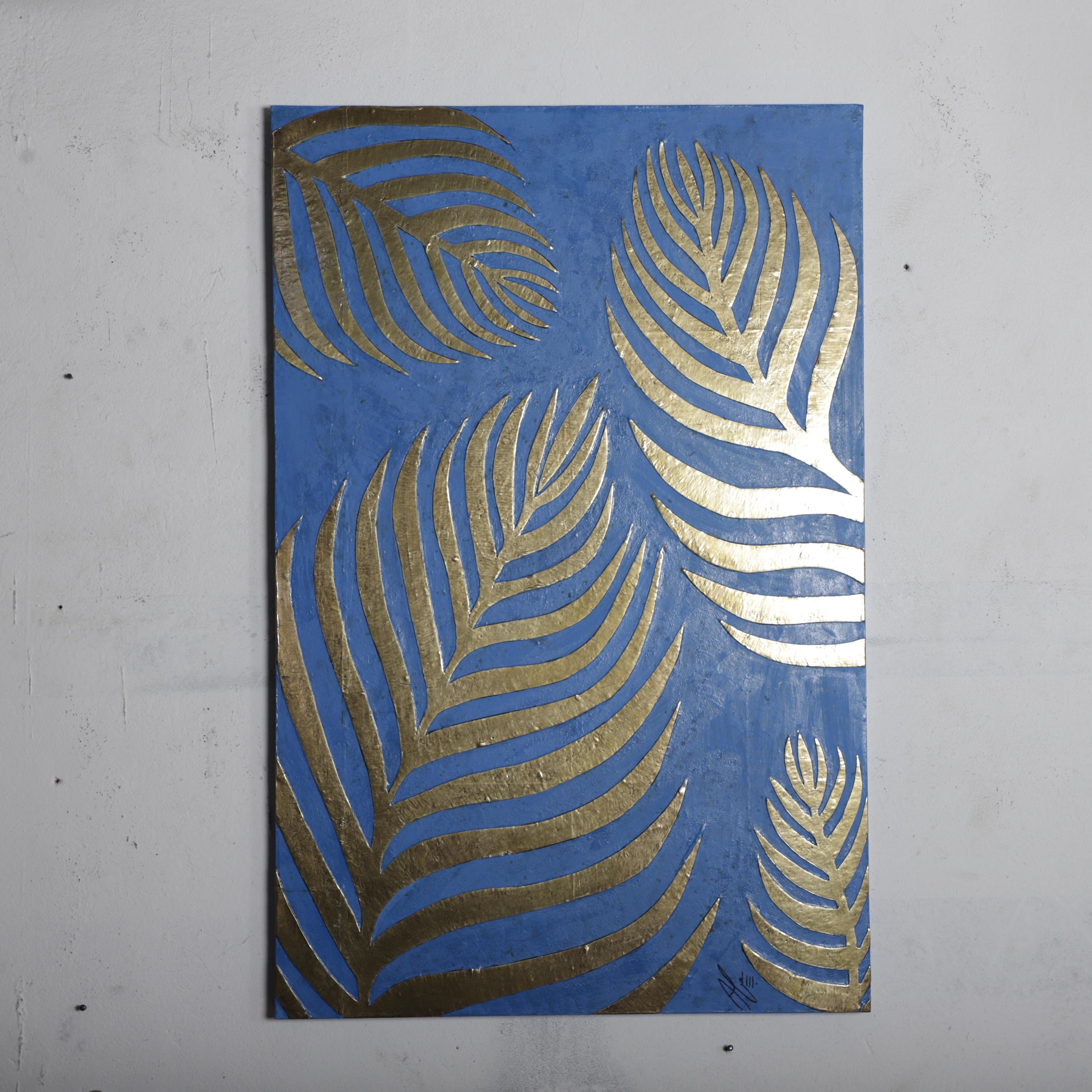 a blue background with gold leaf-like patterns on it.