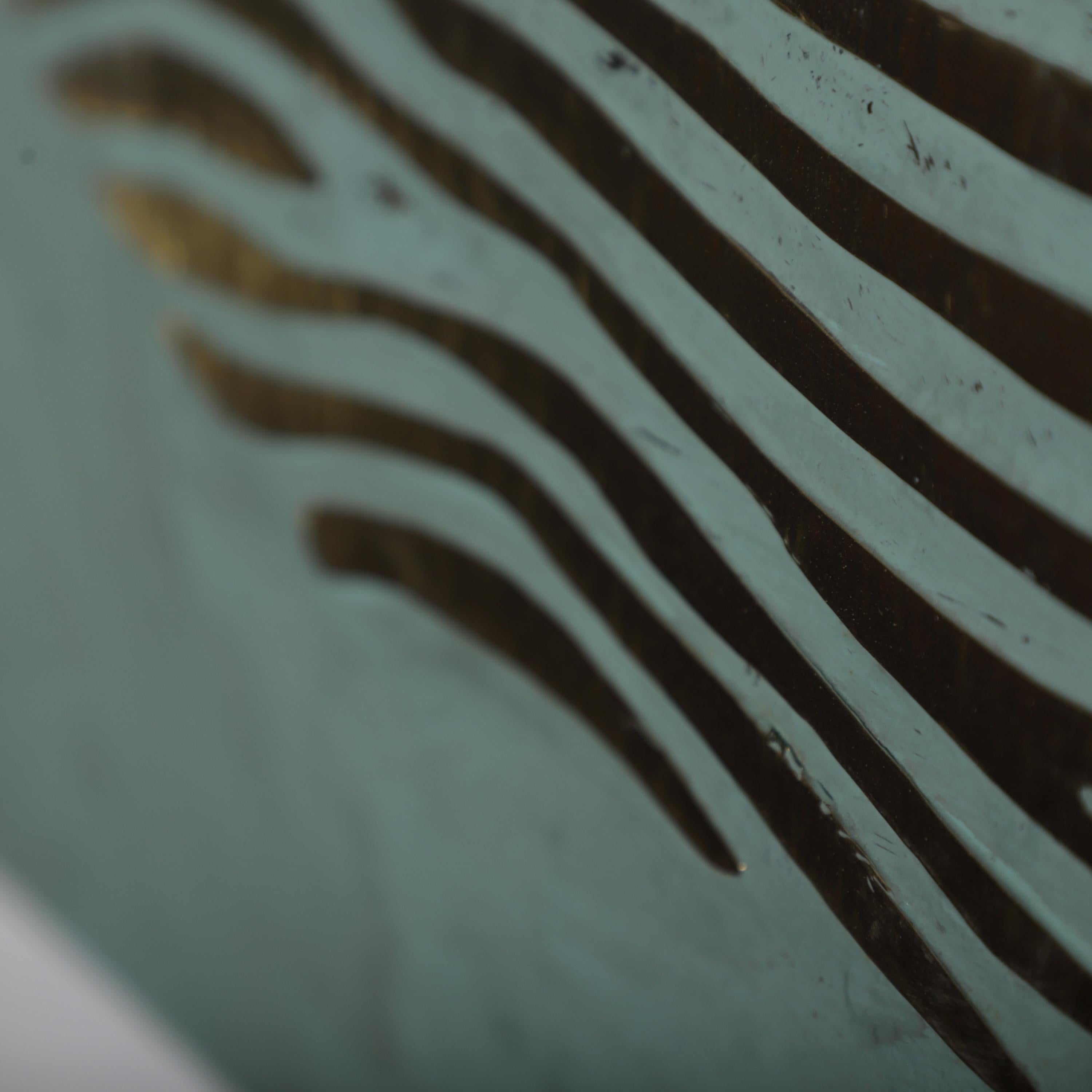 a close-up view of a textured surface with a repeating pattern of black and white stripes.