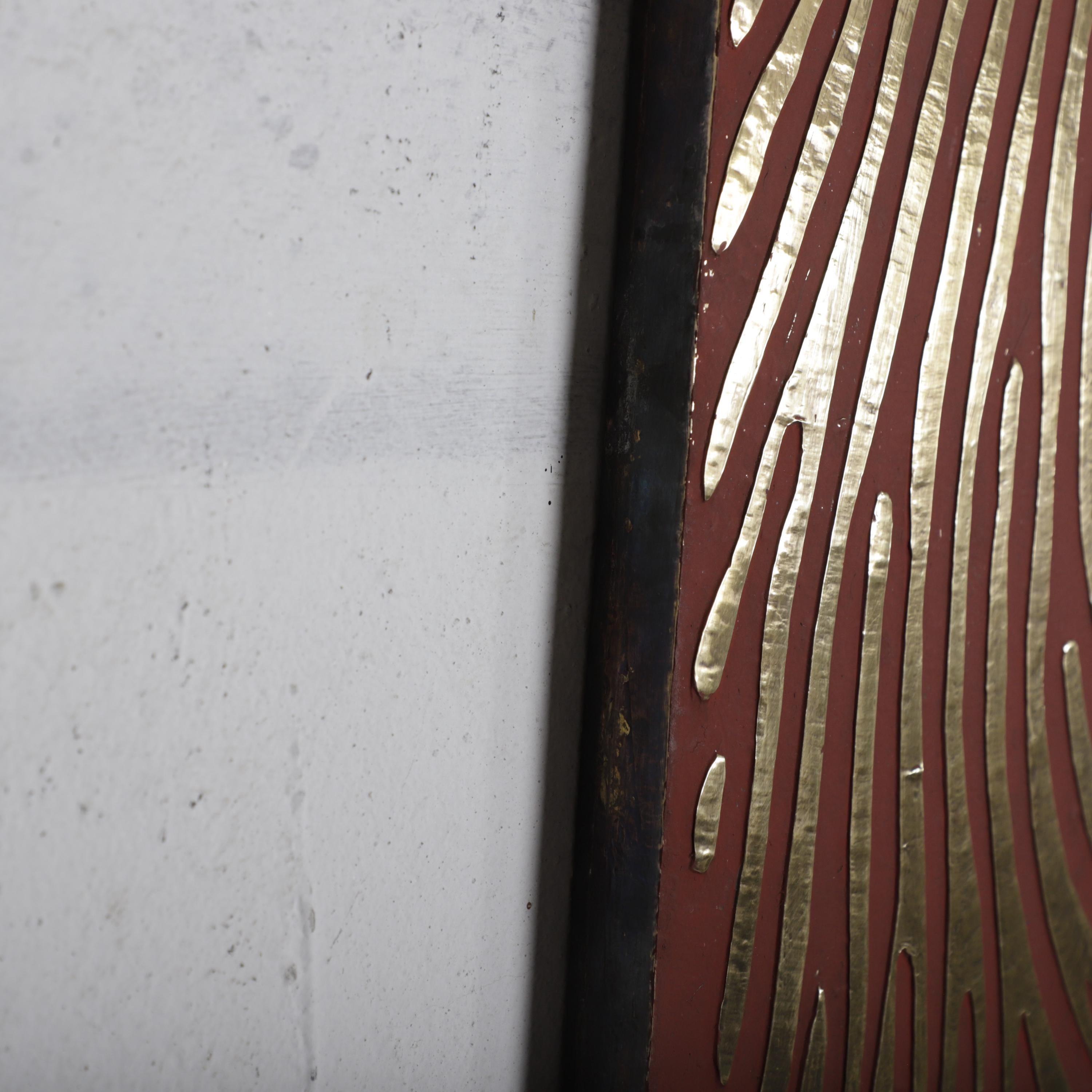 a close-up view of a white wall with a red stripe running along it. The red stripe has a unique zebra-like pattern, adding a distinctive visual element to the scene.