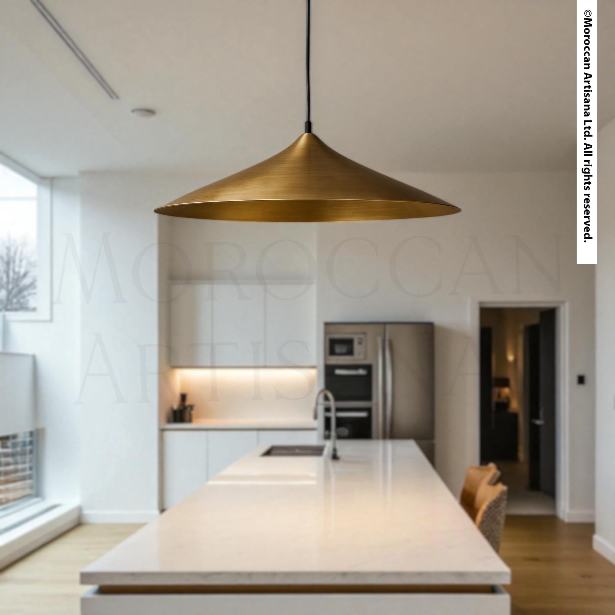 a modern kitchen with a large pendant light hanging above a white countertop.