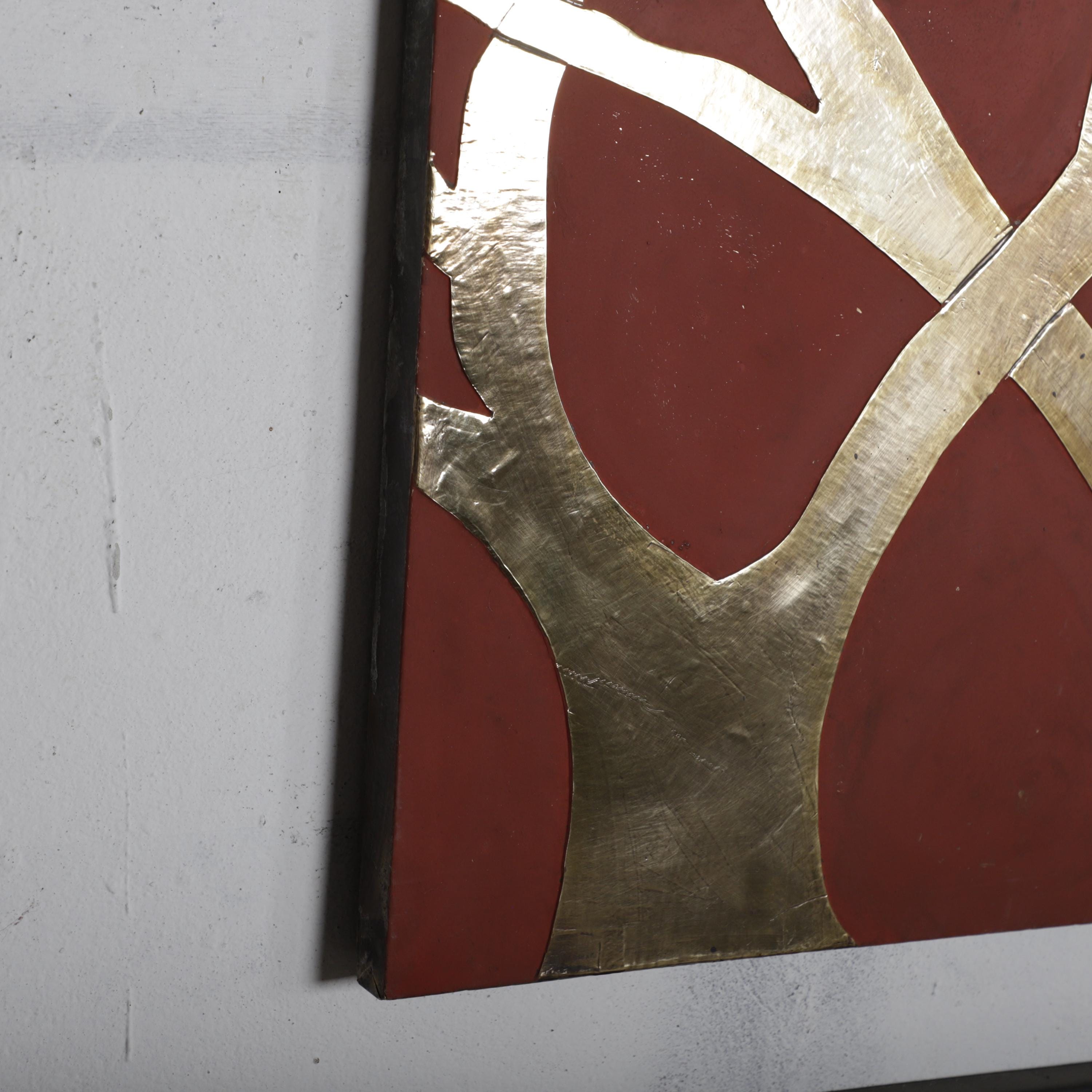 a striking abstract artwork with bold red and gold colors, creating a visually captivating composition.